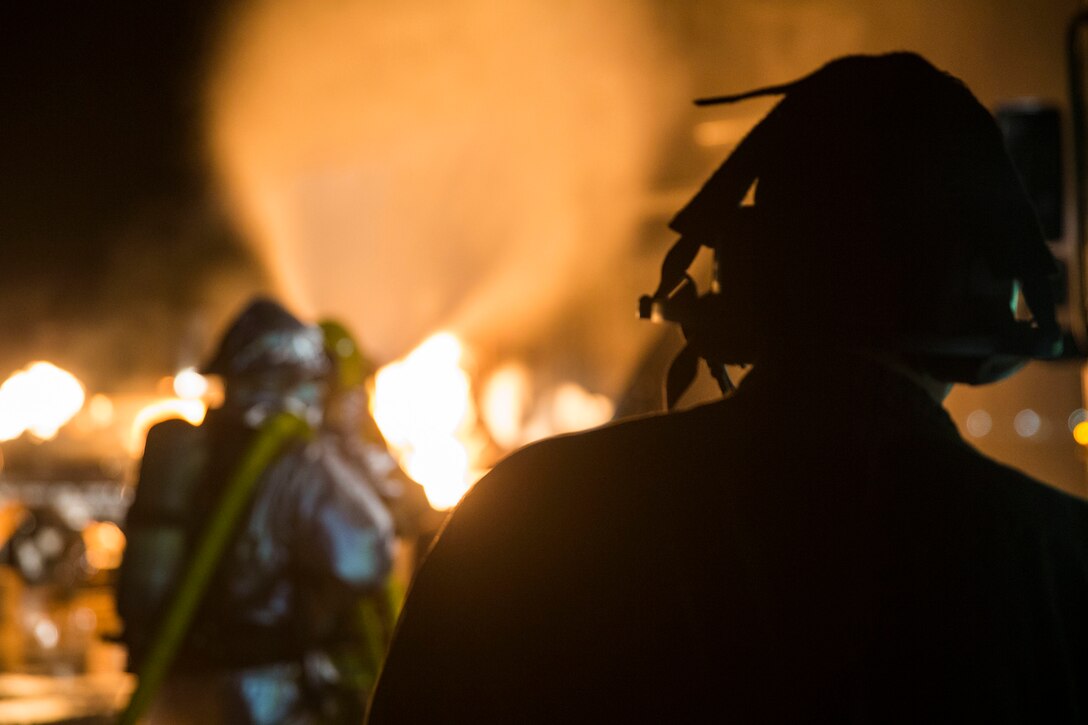 U.S. Marines with Aircraft Rescue and Fire Fighting (ARFF) conduct Hand Line Drills at Marine Corps Air Station (MCAS) Yuma Feb. 15, 2019. These drills focus on techniques to push fuel fires away from aircraft and simulate large aircraft fire fighting. The Marines train monthly to enhance their readiness when responding to hazards or emergencies on the flight line. (U.S. Marine Corps photo by Cpl. Sabrina Candiaflores)