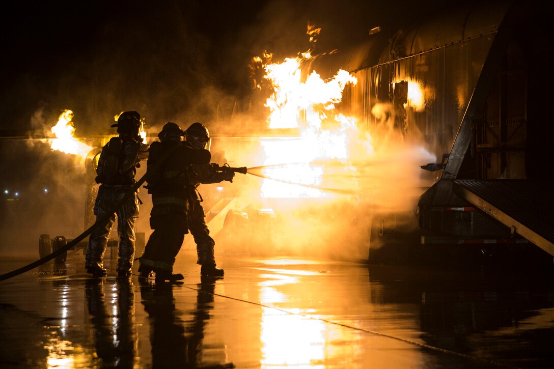 U.S. Marines with Aircraft Rescue and Fire Fighting (ARFF) conduct Hand Line Drills at Marine Corps Air Station (MCAS) Yuma Feb. 15, 2019. These drills focus on techniques to push fuel fires away from aircraft and simulate large aircraft fire fighting. The Marines train monthly to enhance their readiness when responding to hazards or emergencies on the flight line. (U.S. Marine Corps photo by Cpl. Sabrina Candiaflores)