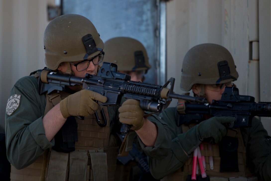 U.S. Marines with the Provost Marshal's Office (PMO), Headquarters and Headquarters Squadron (H&HS), Marine Corps Air Station (MCAS) Yuma, set up the range for Special Reaction Team (SRT) training on range one Yuma, Ariz., Feb 27, 2019. The SRT is Comprised of military police personnel trained to give an installation commander the ability to counter or contain a special threat situation surpassing normal law enforcement capabilities. (U.S. Marine Corps photo by Lance Cpl. Joel Soriano)