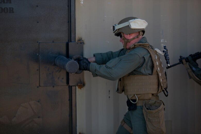 U.S. Marines with the Provost Marshal's Office (PMO), Headquarters and Headquarters Squadron (H&HS), Marine Corps Air Station (MCAS) Yuma, set up the range for Special Reaction Team (SRT) training on range one Yuma, Ariz., Feb 27, 2019. The SRT is Comprised of military police personnel trained to give an installation commander the ability to counter or contain a special threat situation surpassing normal law enforcement capabilities. (U.S. Marine Corps photo by Lance Cpl. Joel Soriano)