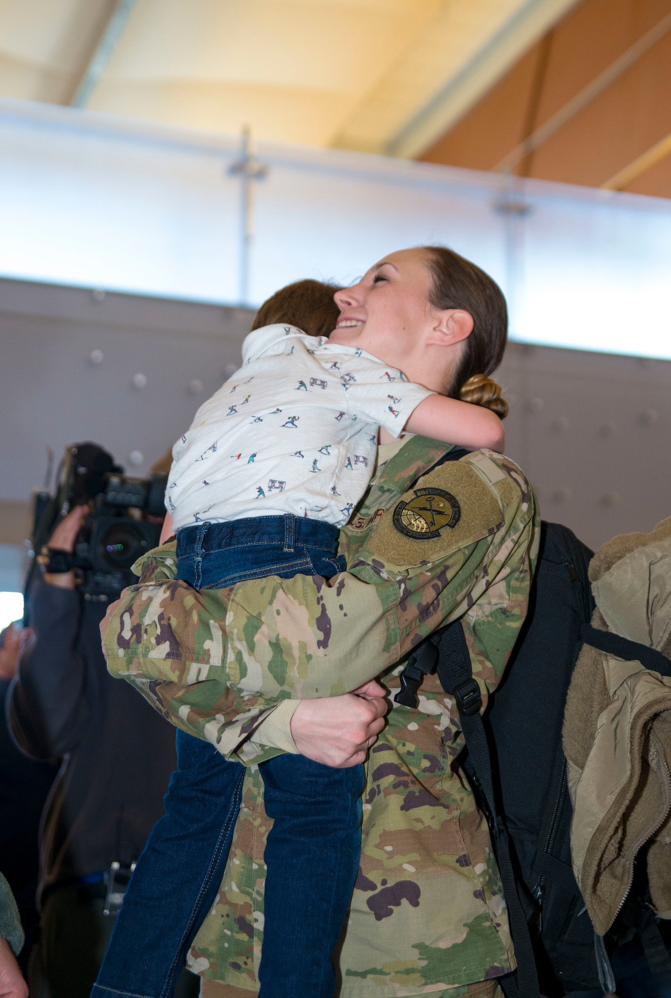 An aerial porter with the 96th Aerial Port Squadron, 913th Airlift Group, Little Rock Air Force Base, Ark. greets family and friends at the local airport. During the week of Feb. 20, 2019, more than 15 Reserve Citizen Airmen returned from various deployments from across Southwest Asia. The Airmen inspect and palletize all cargo before shipment.