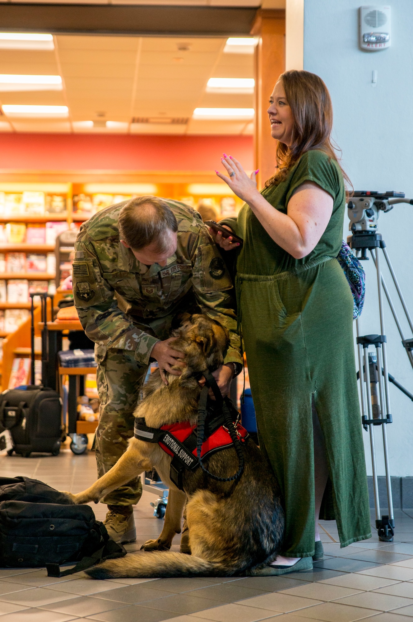 An aerial porter with the 96th Aerial Port Squadron, 913th Airlift Group, Little Rock Air Force Base, Ark. greets family and friends at the local airport. During the week of Feb. 20, 2019, more than 15 Reserve Citizen Airmen returned from various deployments from across Southwest Asia. The Airmen inspect and palletize all cargo before shipment. They also work closely with aircraft loadmasters to carefully position the cargo inside aircraft. (U.S. Air Force photo Capt. Ashley Walker)