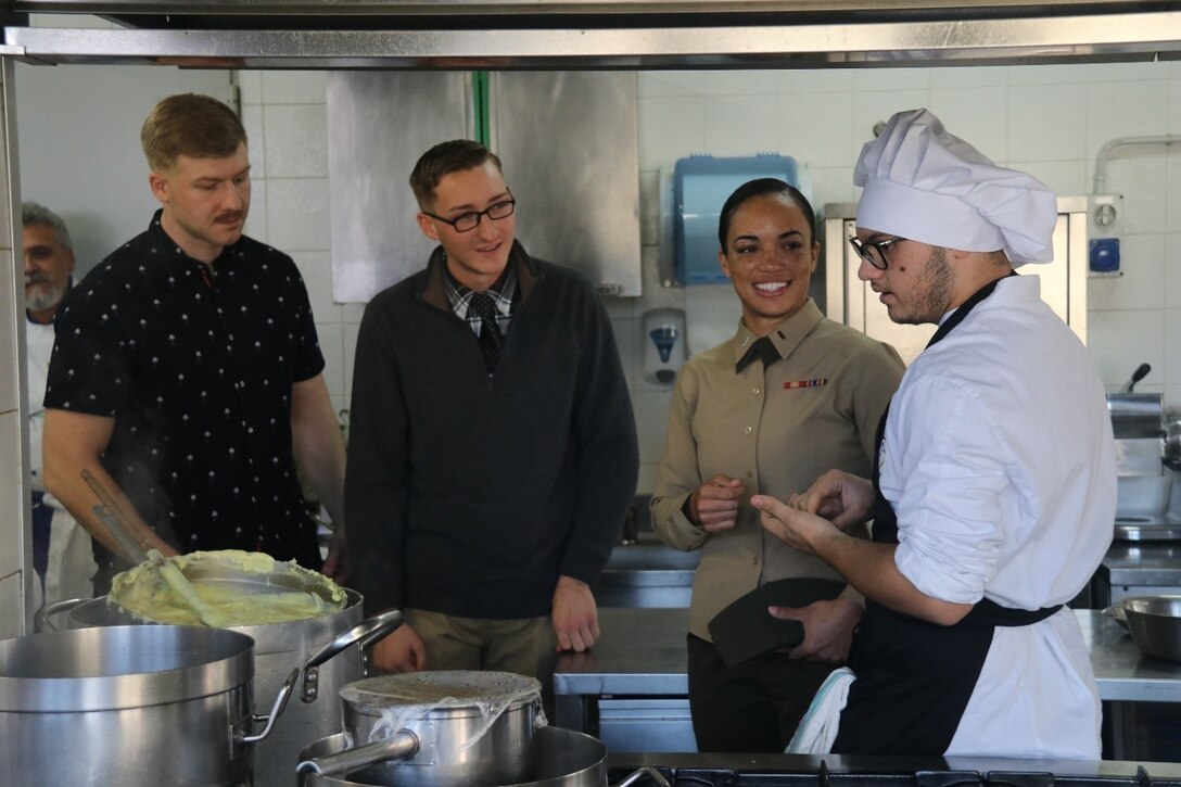 U.S. Marines with Special Purpose Marine Air-Ground Task Force-Crisis Response-Africa 19.1 meet with a student from Istituto Professionale Alberghiero Giovanni Falcone for a language interaction class and a Thanksgiving dinner in Giarre, Italy, Nov. 22, 2018.