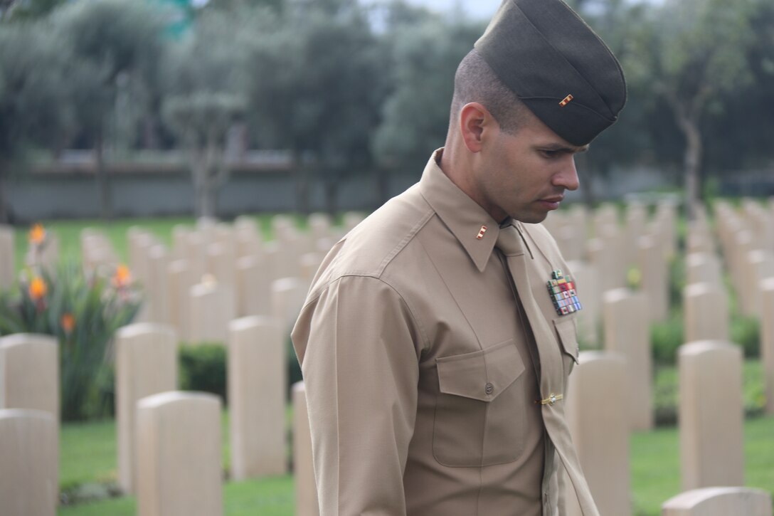 A U.S. Marine with Special Purpose Marine Air-Ground Task Force-Crisis Response-Africa 19.1 attends an Italian Veterans Day wreath-laying ceremony at the Commonwealth War Cemetery in Catania, Italy, Nov. 17, 2018. Marines and Sailors with SPMAGTF-CR-AF strengthen partnerships with the host nation by participating in community relations events during their deployment. SPMAGTF-CR-AF is deployed to conduct crisis-response and theater-security operations in Europe and Africa. (U.S. Marine Corps photo by 1stLt. Christin St. John)