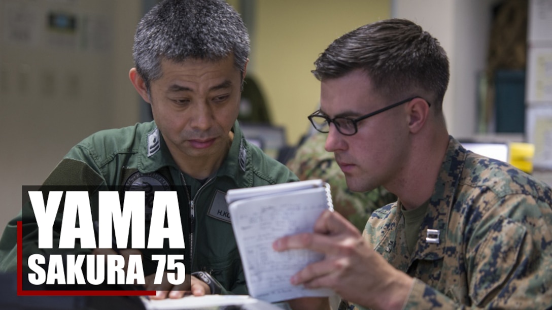 U.S. Marine Capt. Ryan Hawley coordinates air support missions with Maj. Higaharu Kobayashi during Yama Sakura 75 on Camp Courtney, Okinawa, Japan, Dec. 13, 2018. Yama Sakura focuses on the development and refinement of Japan Self-Defense Force and U.S. military bilateral efforts in the areas of coordination, interoperability, and planning through training. Hawley is a firepower controller with 2nd Brigade platoon, 5th Air Naval Gunfire Liaison Company. Kobayashi is an air force coordinator with Japan Ground Self-Defense Force’s Air Defense Command. (U.S. Marine Corps photo by Sgt. Timothy Valero)