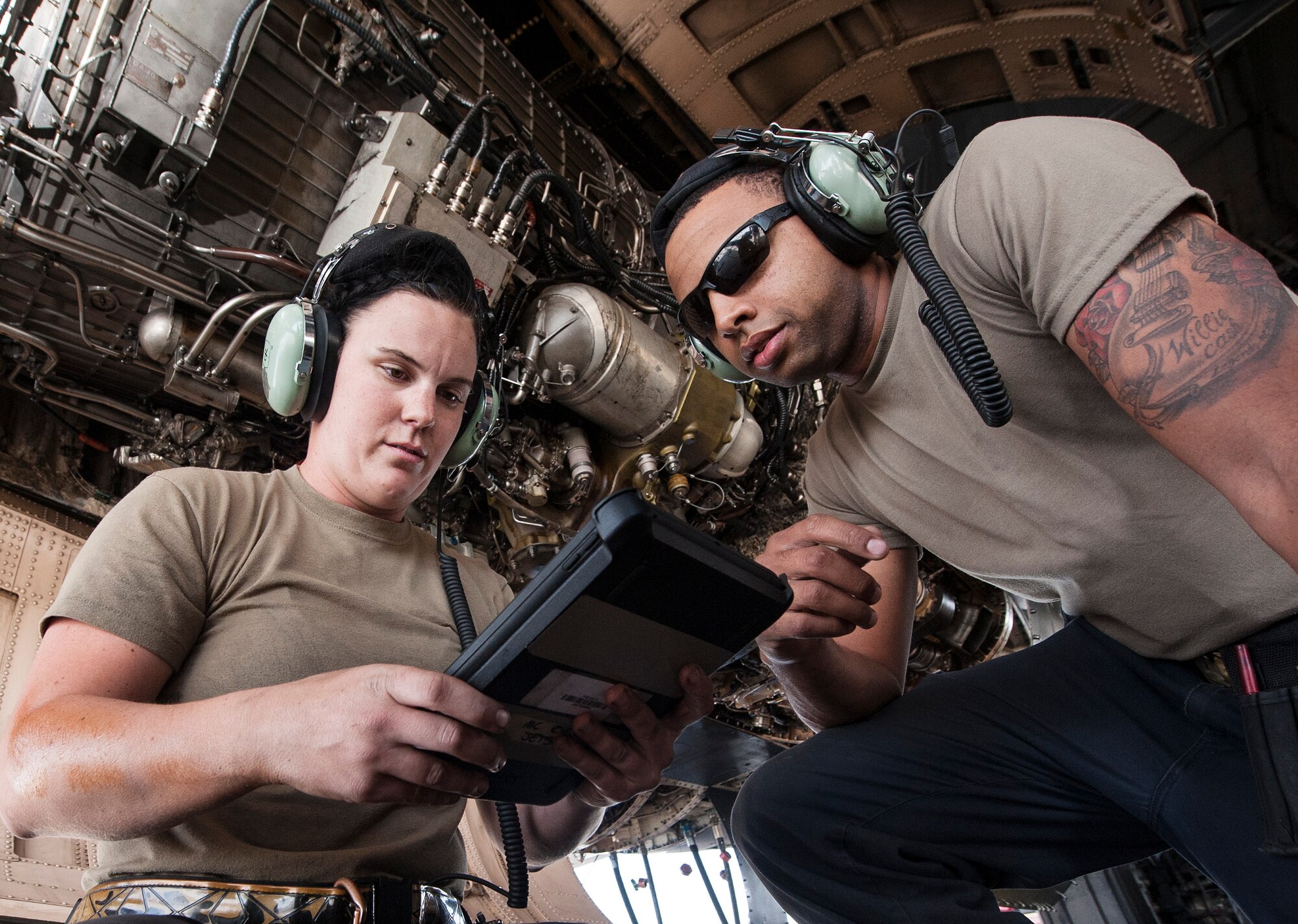 Airman 1st Class Shelby Ries, left, 379th Expeditionary Aircraft Maintenance Squadron (EAMXS) B-1B Lancer propulsion apprentice, and Staff Sgt. Jason Blackmon, 379th EAMXS B-1B Lancer propulsion craftsman, review technical orders while conducting routine maintenance for a B-1B Lancer Dec. 22, 2018, at Al Udeid Air Base, Qatar. Due to Ries’s exceptional performance she was selected to deploy to Al Udeid as an area of responsibility (AOR) advanced echelon (ADVON) team member. Ries led two engine changes and more than 90 maintenance actions which resulted in 56 B-1B sorties, totaling 672 flying hours. (U.S. Air Force photo by Tech. Sgt. Christopher Hubenthal)