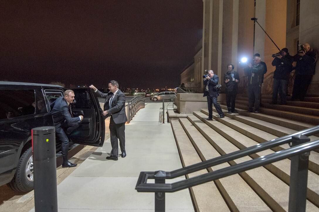 Acting Defense Secretary Patrick M. Shanahan is greeted by reporters after arriving at the Pentagon.