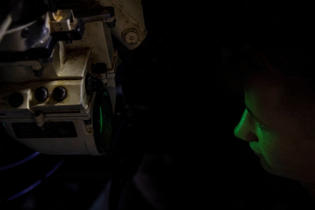 Lance Cpl. Quentin Francomano, a M88A2 Hercules recovery vehicle driver and tank mechanic with the 22nd Marine Expeditionary Unit, looks through a gun sight while conducting routine maintenance aboard the USS Kearsarge, Dec. 27, 2018. The 22nd MEU is currently on deployment to the 5th and 6th fleet areas of responsibility with the Kearsarge Amphibious Ready Group.