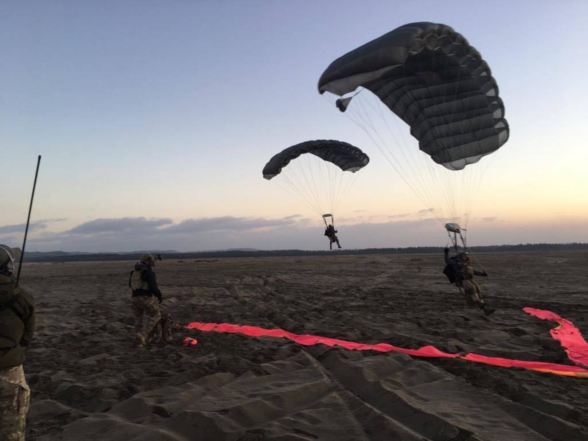 Combat controllers from the U.S. and Polish forces conduct a military free fall during a culmination exercise near Krakow on Dec. 5, 2018.