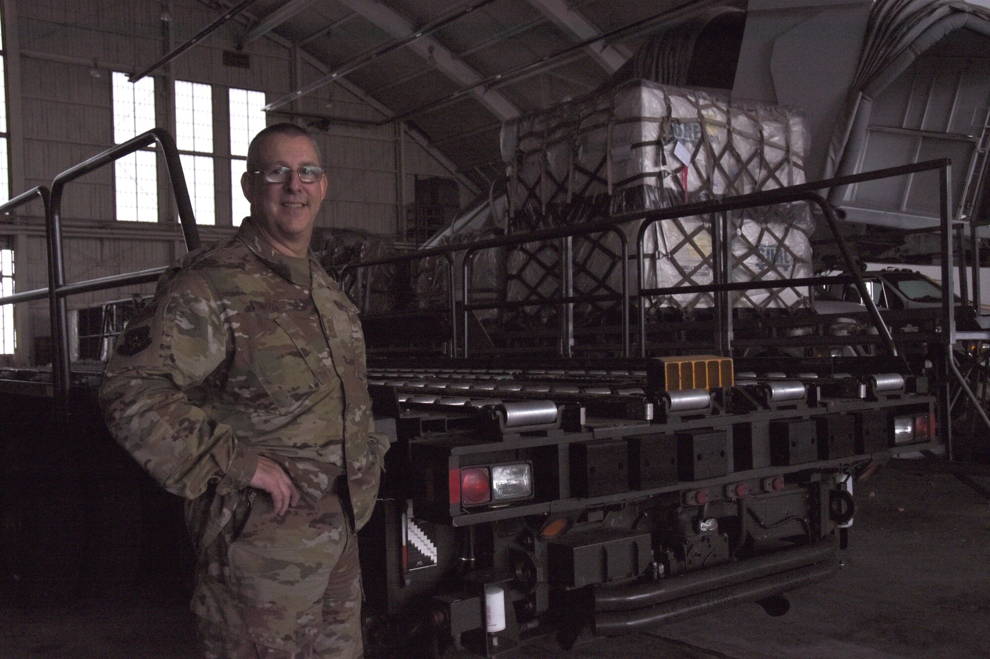 Chief Master Sgt. Daniel Witt standing by K-Loader