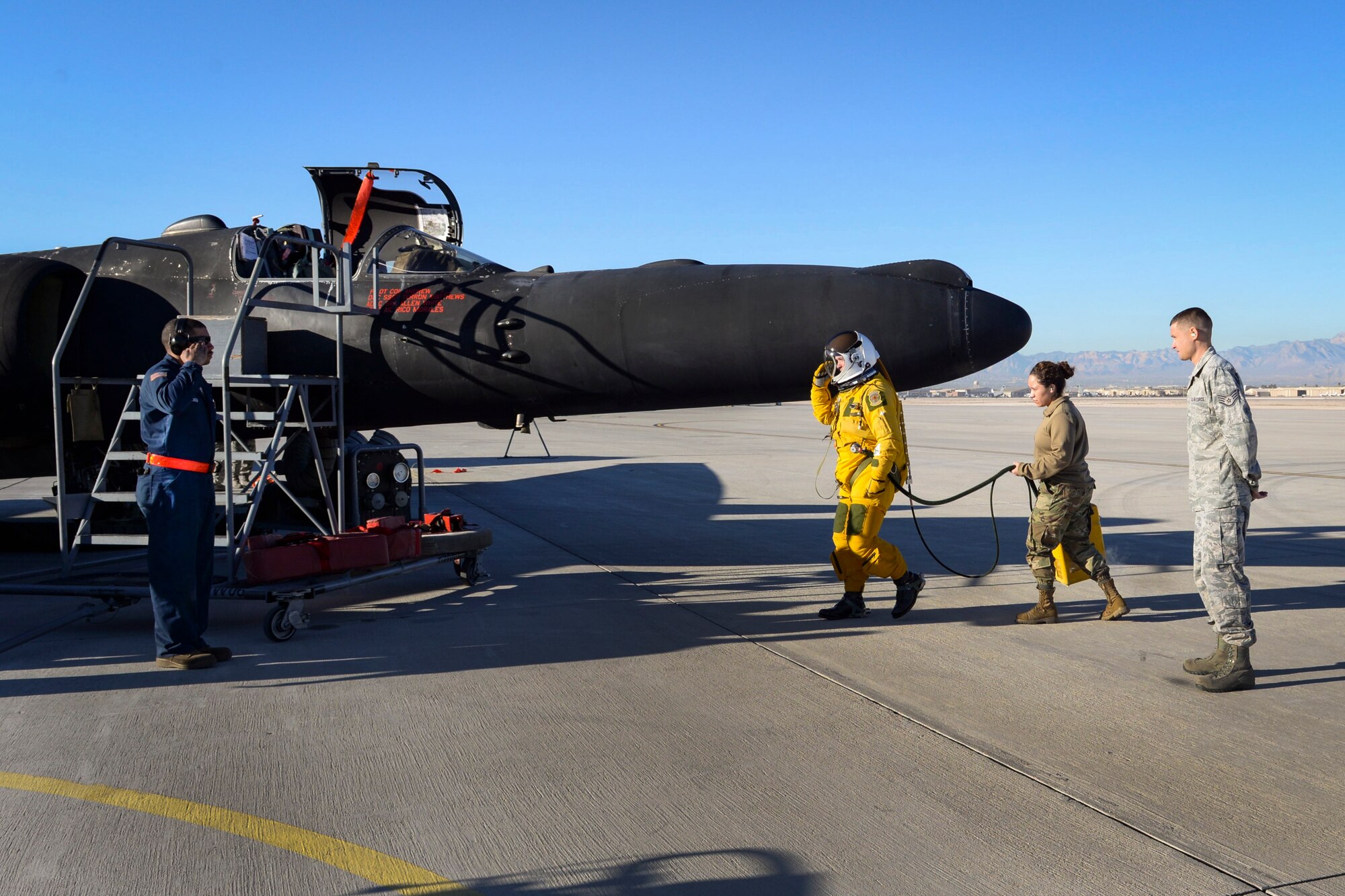 A pilot salutes his maintainer before boarding his aircraft.