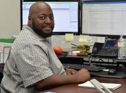 Autry Fontenot, a budget analyst in the 12th Operations Group at Joint Base San Antonio-Randolph, Texas, poses for a photo in his office in Hangar 63. The Air Force named him its installation-level Resource Advisor of the Year for 2018. Fontenot supports pilot training innovations by managing millions of dollars.