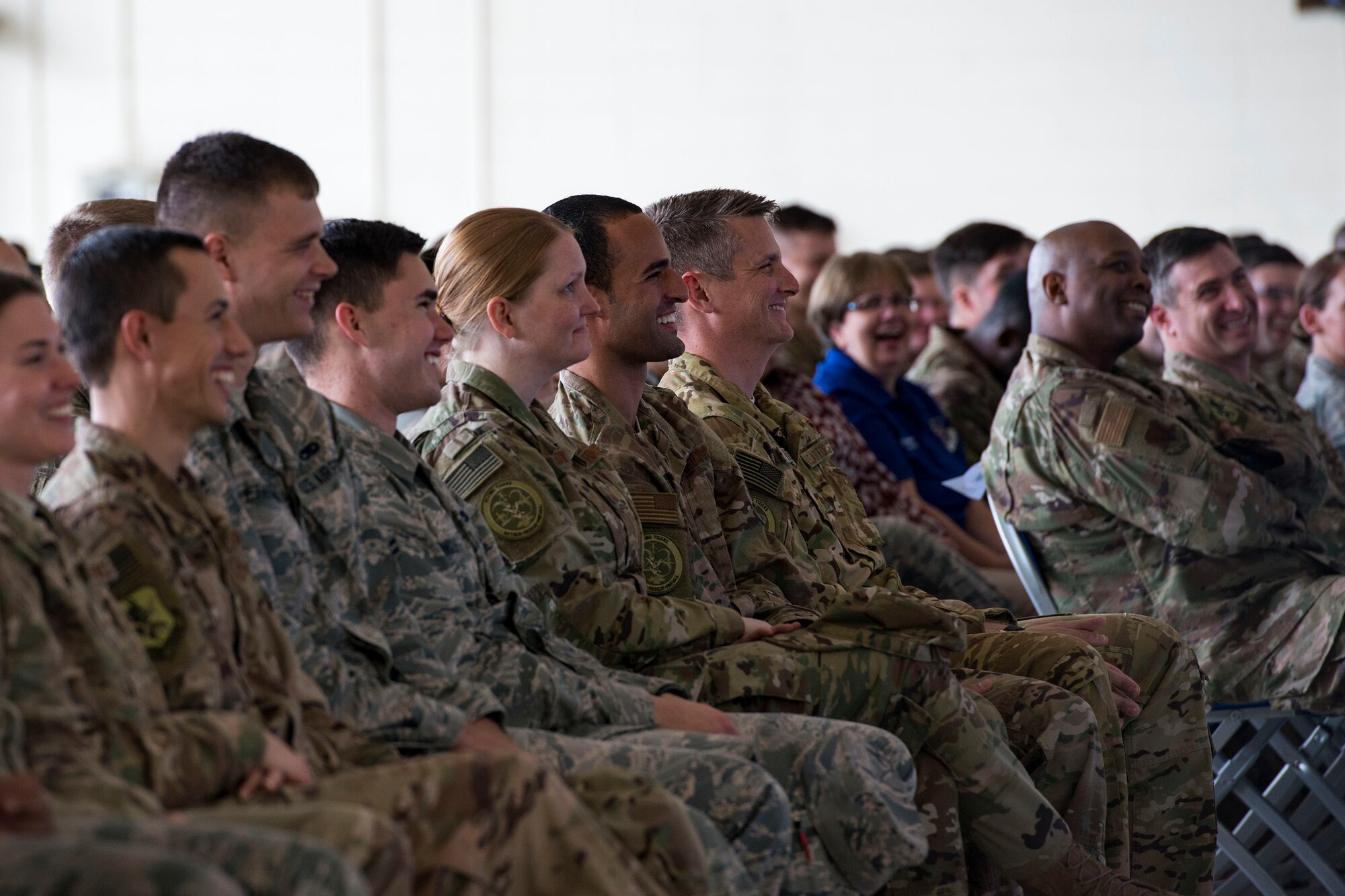 Audience members laugh at a joke during a safety briefing, Jan. 2, 2019, at Moody Air Force Base, Ga. Team Moody started the New Year with a clean slate by picking up debris off the flightline this morning, ensuring a safe runway for training and deploying warriors throughout the year. We also had the honor of hearing guest speaker Bernie McGrenahan, a comedian with a powerful training and prevention-based session at the end of his show. Thank you to the Wing Safety Office for putting this day together and starting the year off right! (U.S. Air Force photo by Airman 1st Class Erick Requadt)