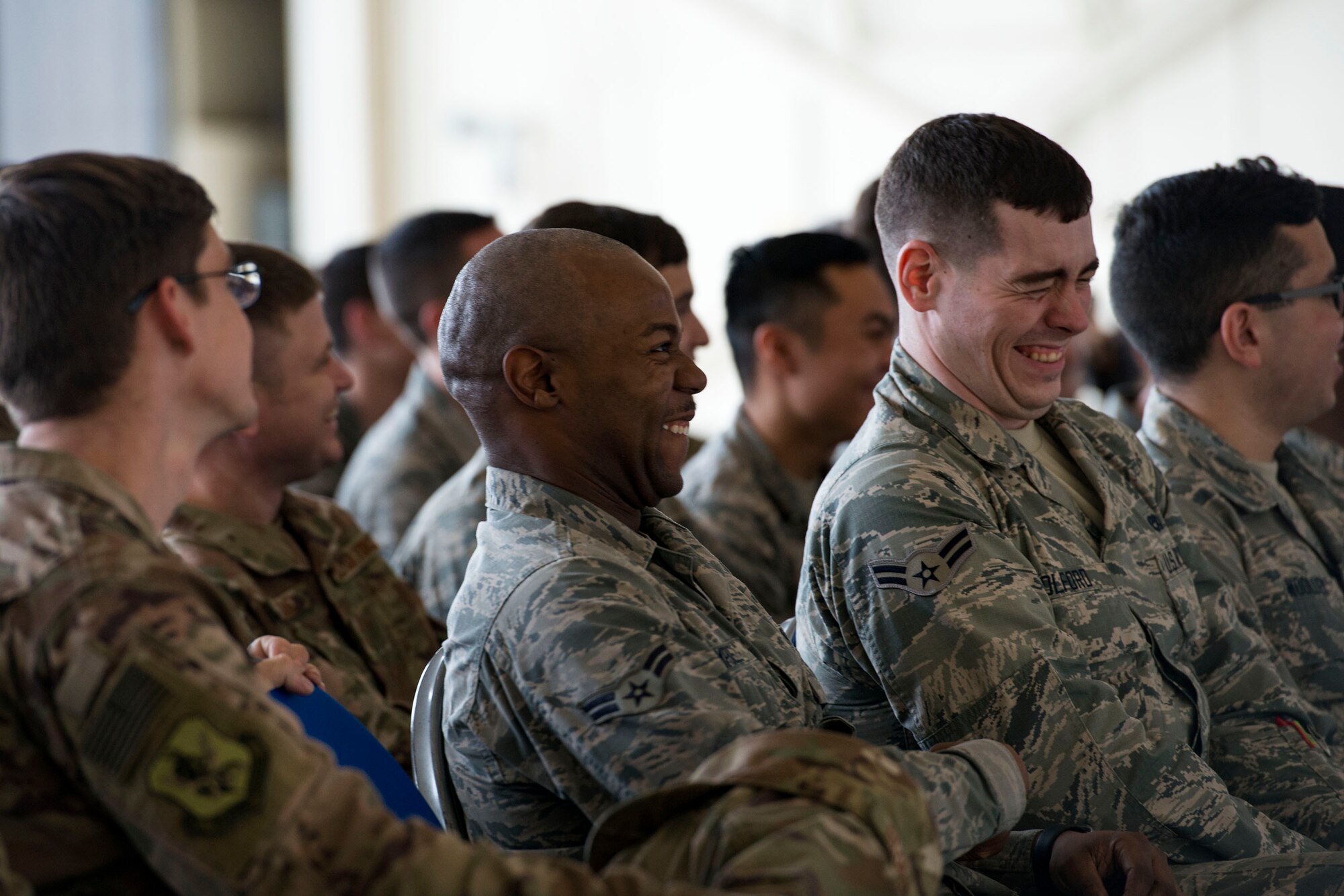 Audience members laugh at a joke during a safety briefing, Jan. 2, 2019, at Moody Air Force Base, Ga. Team Moody started the New Year with a clean slate by picking up debris off the flightline this morning, ensuring a safe runway for training and deploying warriors throughout the year. We also had the honor of hearing guest speaker Bernie McGrenahan, a comedian with a powerful training and prevention-based session at the end of his show. Thank you to the Wing Safety Office for putting this day together and starting the year off right! (U.S. Air Force photo by Airman 1st Class Erick Requadt)
