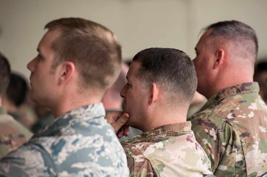 Team Moody Airmen listen to a speaker during a flight safety meeting, Jan. 2, 2019, at Moody Air Force Base, Ga.Team Moody started the New Year with a clean slate by picking up debris off the flightline this morning, ensuring a safe runway for training and deploying warriors throughout the year. We also had the honor of hearing guest speaker Bernie McGrenahan, a comedian with a powerful training and prevention-based session at the end of his show. Thank you to the Wing Safety Office for putting this day together and starting the year off right! (U.S. Air Force photo by Airman 1st Class Erick Requadt)