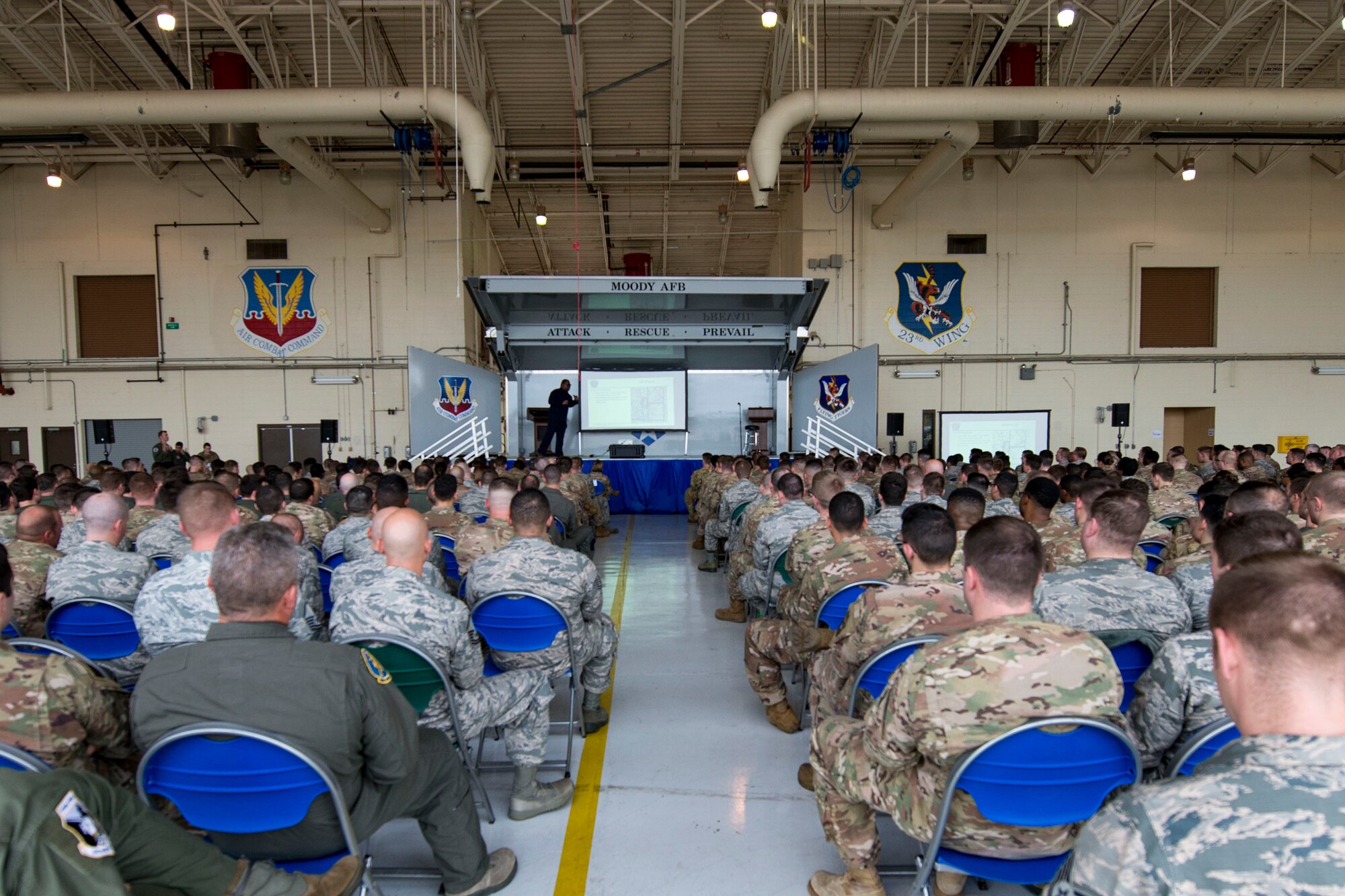 Team Moody Airmen listen to Lee Walters, 23d Operations Support Squadron airfield manager, during a flight safety meeting, Jan. 2, 2019, at Moody Air Force Base, Ga. Team Moody started the New Year with a clean slate by picking up debris off the flightline this morning, ensuring a safe runway for training and deploying warriors throughout the year. We also had the honor of hearing guest speaker Bernie McGrenahan, a comedian with a powerful training and prevention-based session at the end of his show. Thank you to the Wing Safety Office for putting this day together and starting the year off right! (U.S. Air Force photo by Airman 1st Class Erick Requadt)