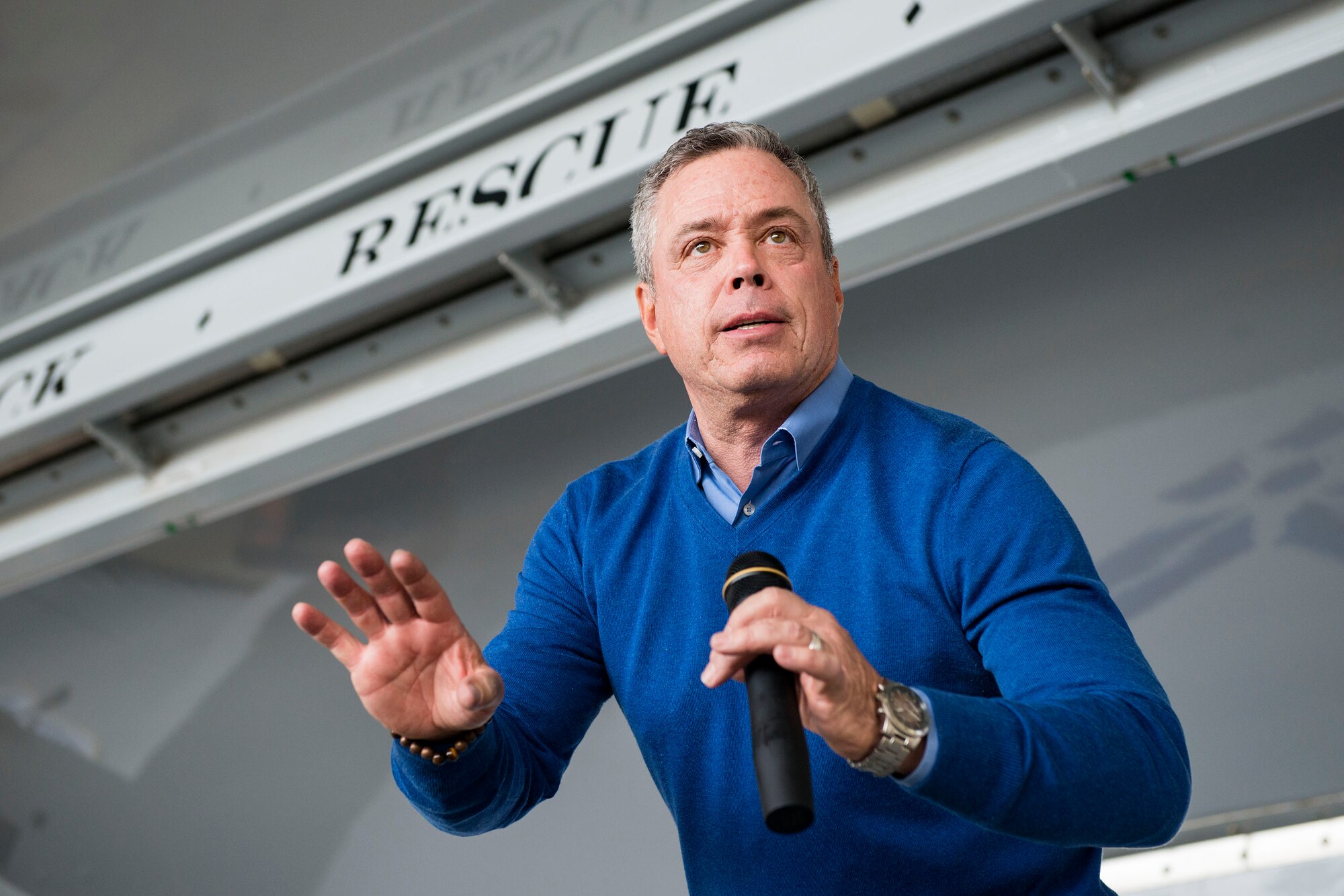 Bernie McGrenahan, comedian, performs stand-up comedy during a safety briefing, Jan. 2, 2019, at Moody Air Force Base, Ga. Team Moody started the New Year with a clean slate by picking up debris off the flightline this morning, ensuring a safe runway for training and deploying warriors throughout the year. We also had the honor of hearing guest speaker Bernie McGrenahan, a comedian with a powerful training and prevention-based session at the end of his show. Thank you to the Wing Safety Office for putting this day together and starting the year off right! (U.S. Air Force photo by Airman 1st Class Erick Requadt)