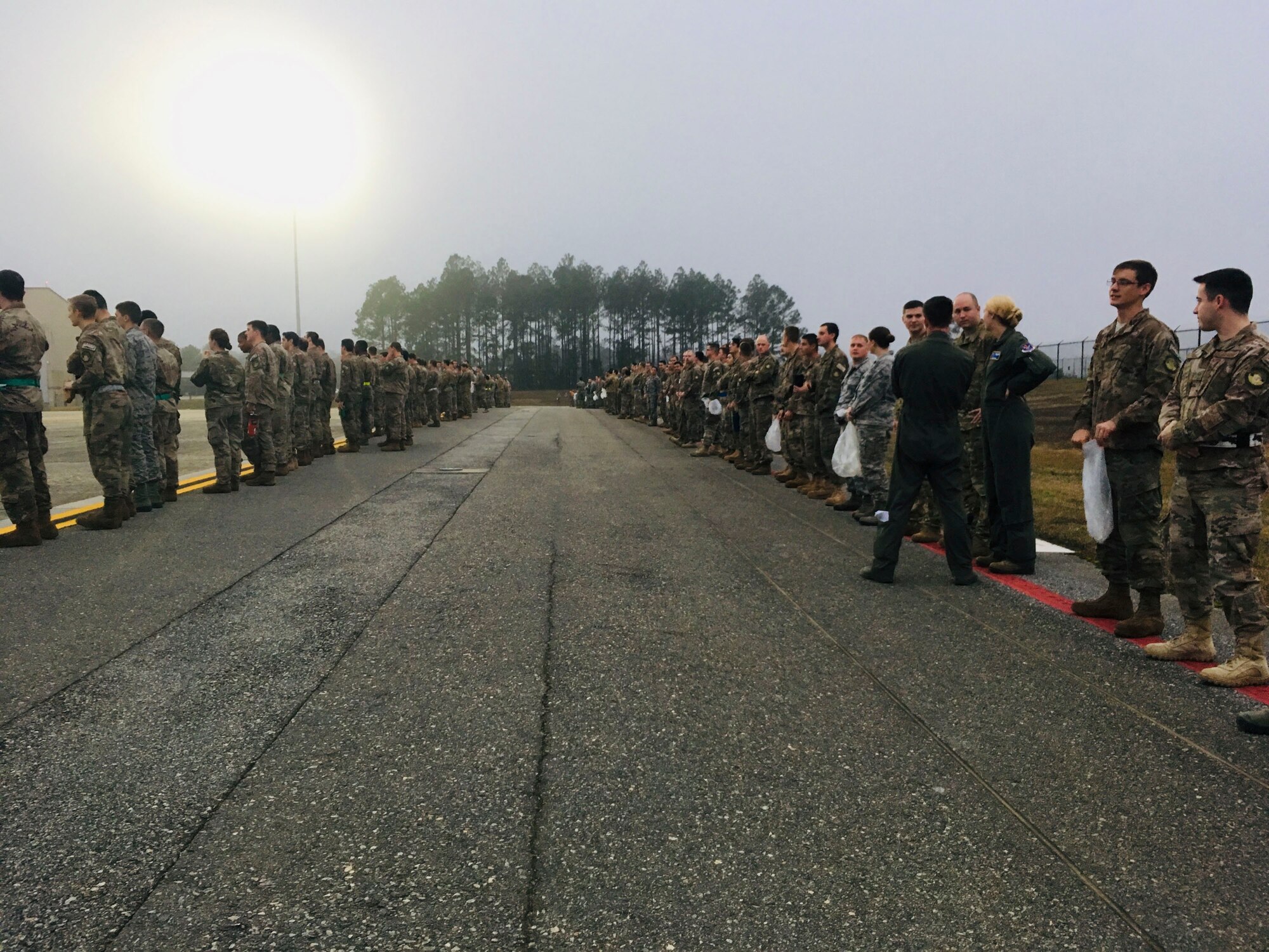 Team Moody Airmen line up on the flight line during a foreign object debris (FOD) walk, Jan. 2, 2019, at Moody Air Force Base, Ga.Team Moody started the New Year with a clean slate by picking up debris off the flightline this morning, ensuring a safe runway for training and deploying warriors throughout the year. We also had the honor of hearing guest speaker Bernie McGrenahan, a comedian with a powerful training and prevention-based session at the end of his show. Thank you to the Wing Safety Office for putting this day together and starting the year off right! (U.S. Air Force photo by Airman 1st Class Erick Requadt)