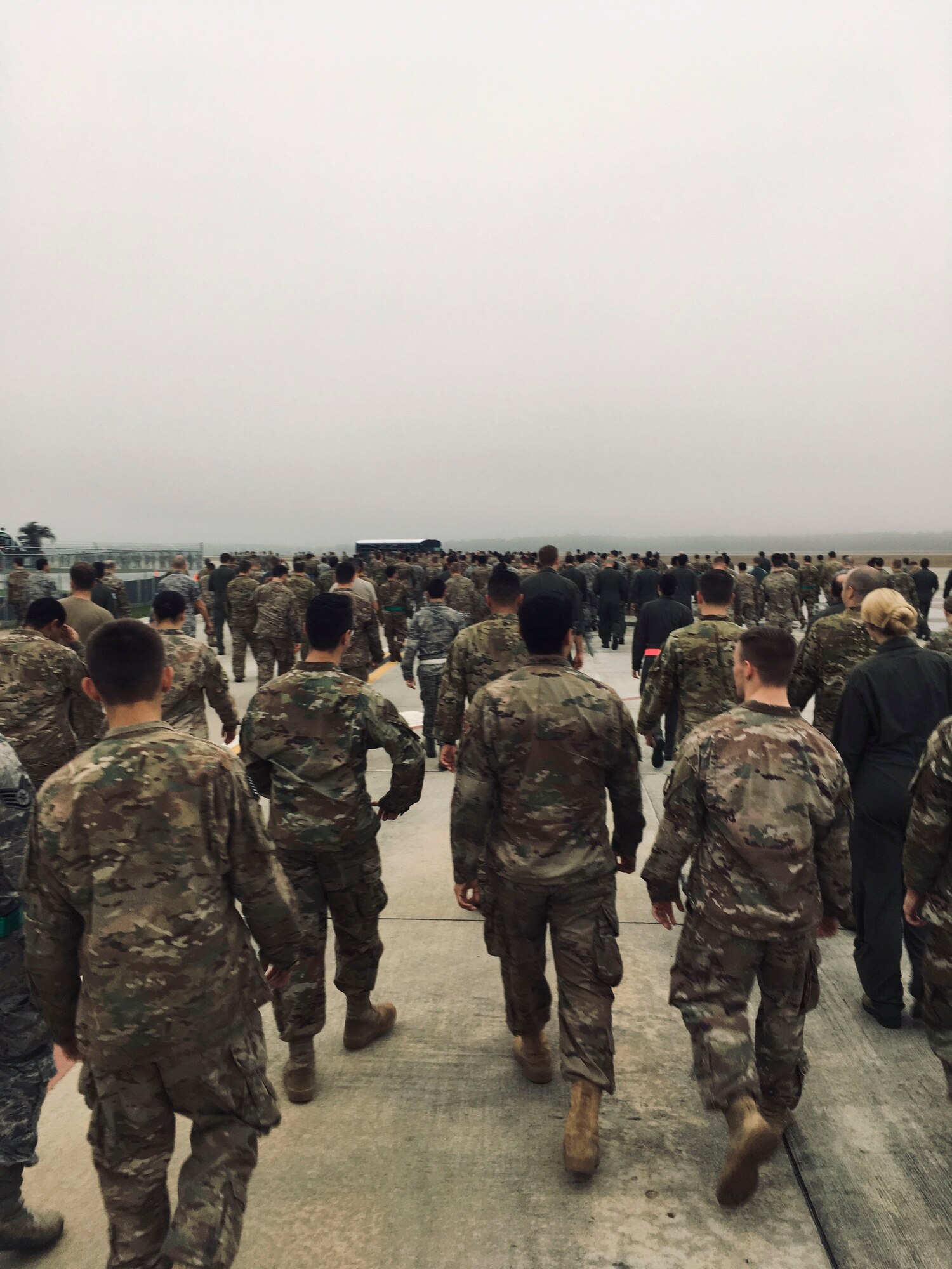 Team Moody Airmen make their way back after picking up debris during a foreign object debris (FOD) walk, Jan. 2, 2019, at Moody Air Force Base, Ga. Team Moody started the New Year with a clean slate by picking up debris off the flightline this morning, ensuring a safe runway for training and deploying warriors throughout the year. We also had the honor of hearing guest speaker Bernie McGrenahan, a comedian with a powerful training and prevention-based session at the end of his show. Thank you to the Wing Safety Office for putting this day together and starting the year off right! (U.S. Air Force photo by Airman 1st Class Erick Requadt)
