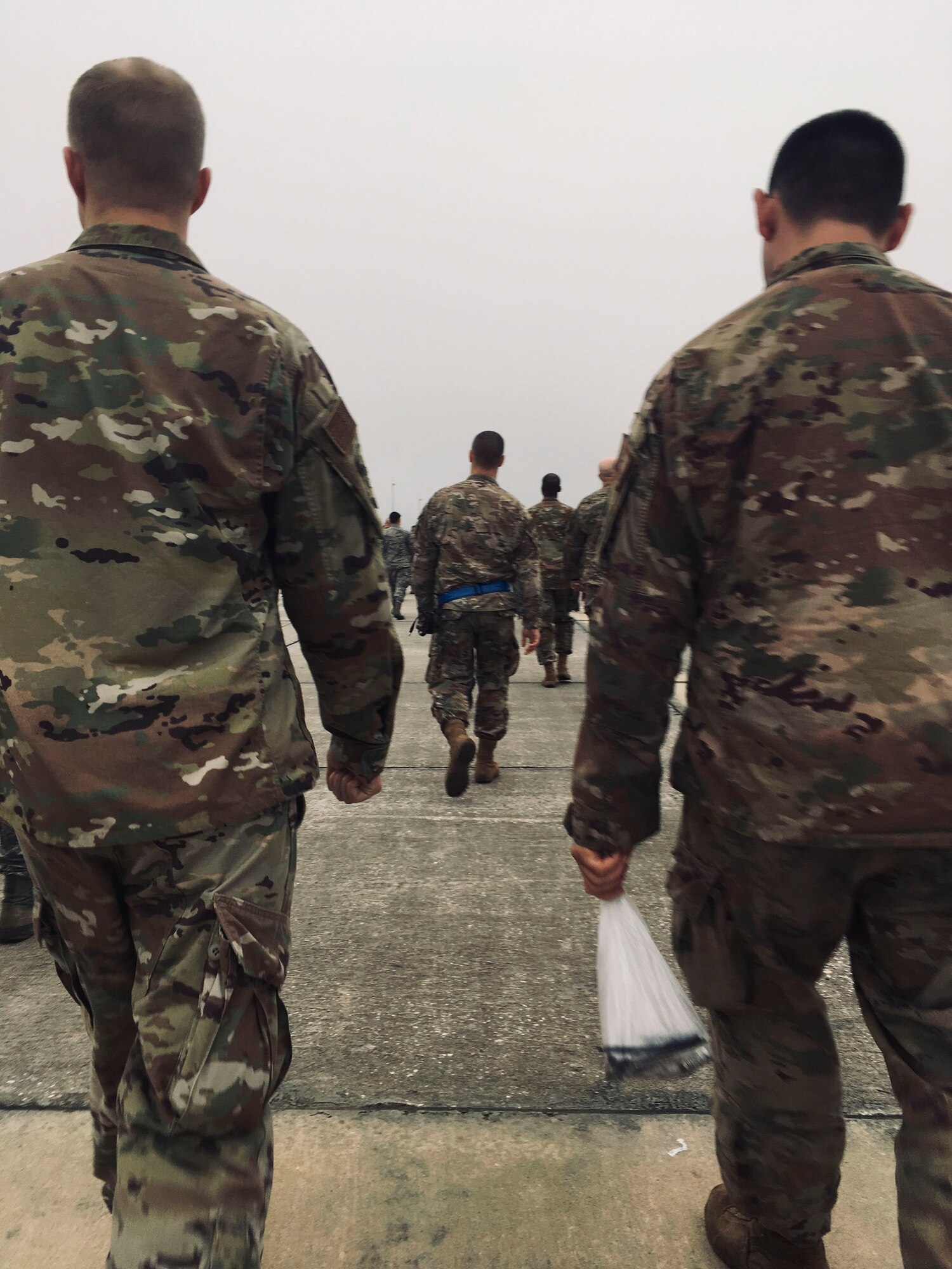 Team Moody Airmen look for debris on the flight line during a foreign object debris (FOD) walk, Jan. 2, 2019, at Moody Air Force Base, Ga. Team Moody started the New Year with a clean slate by picking up debris off the flightline this morning, ensuring a safe runway for training and deploying warriors throughout the year. We also had the honor of hearing guest speaker Bernie McGrenahan, a comedian with a powerful training and prevention-based session at the end of his show. Thank you to the Wing Safety Office for putting this day together and starting the year off right! (U.S. Air Force photo by Airman 1st Class Erick Requadt)