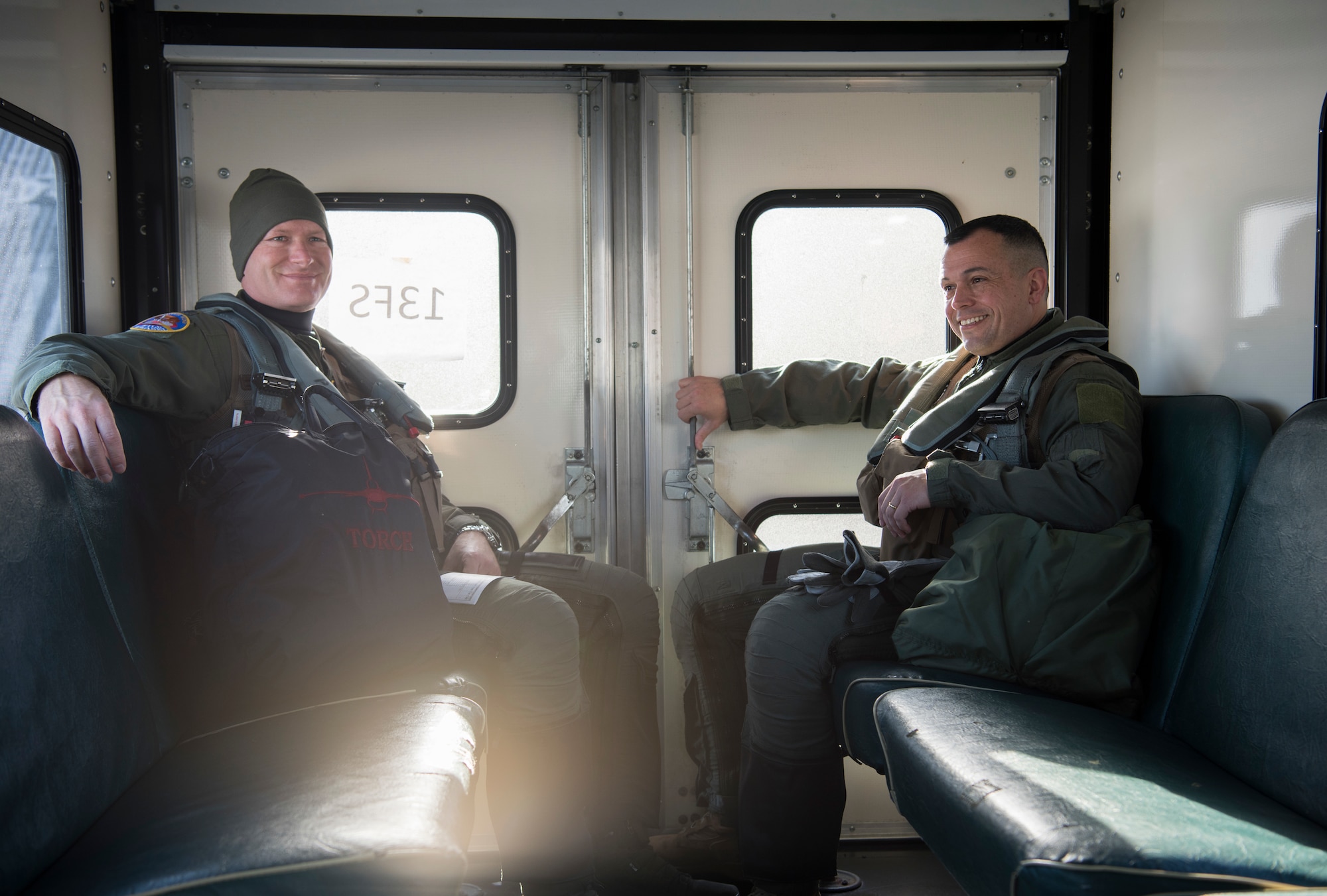 U.S. Air Force Col. Kristopher Struve, left, the 35th Fighter Wing commander, and Chief Master Sgt. John Alsvig, right, the 35th FW command chief, ride in a truck out to a F-16 Fighting Falcon at Misawa Air Base, Japan, Dec. 28, 1018. Struve, a seasoned F-16 Fighting Falcon pilot with more than 2,500 flying hours, gave Alsvig a familiarization flight. Both Struve and Alsvig have been stationed at Misawa AB three times over their careers. (U.S. Air Force photo by Staff Sgt. B.A. Chase)