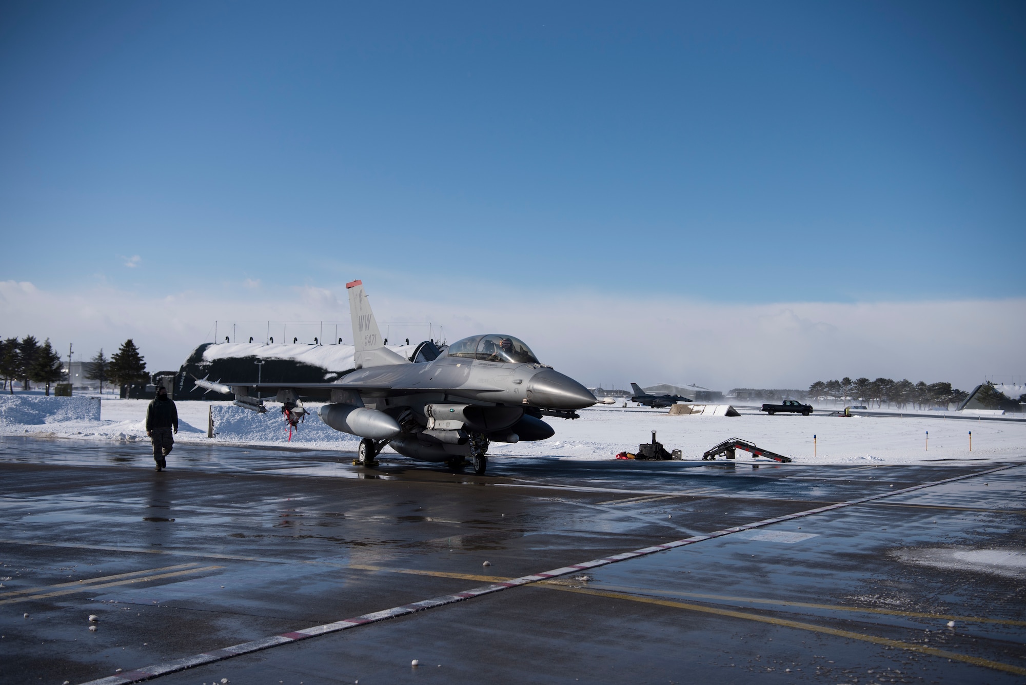 U.S. Air Force Col. Kristopher Struve, the 35th Fighter Wing commander, and Chief Master Sgt. John Alsvig, the 35th FW command chief, prepare to taxi to the runway at Misawa Air Base, Japan, Dec. 28, 1018. Struve, a seasoned F-16 Fighting Falcon pilot with more than 2,500 flying hours, gave Alsvig a familiarization flight, allowing him to see first hand what pilots endure during a routine flight. (U.S. Air Force photo by Staff Sgt. B.A. Chase)