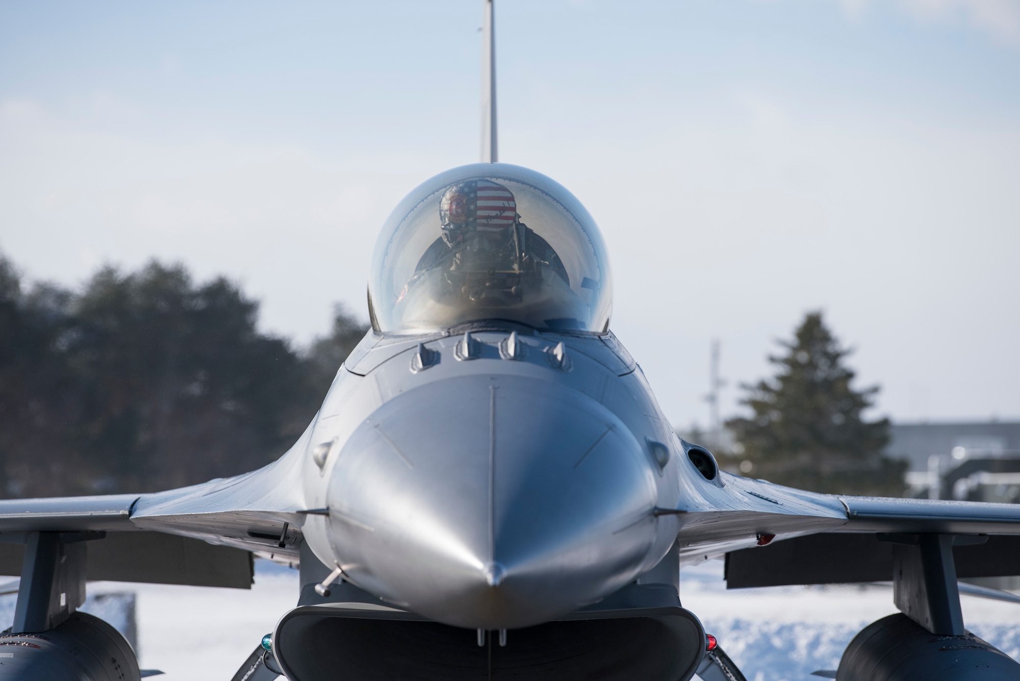 U.S. Air Force Col. Kristopher Struve, the 35th Fighter Wing commander, strap into an F-16 Fighting Falcon at Misawa Air Base, Japan, Dec. 28, 1018. Struve is a seasoned F-16 Fighting Falcon pilot with more than 2,500 flying hours. He also commanded the 13th Fighter Squadron from June 2015 to July 2016 and led them in the opening days of operations reentering Iraq and into Syria as part of OPERATION INHERENT RESOLVE. (U.S. Air Force photo by Staff Sgt. B.A. Chase)