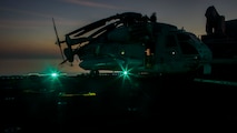 A U.S. Marine CH-53E Super Stallion with Marine Medium Tiltrotor Squadron 166 Reinforced, 13th Marine Expeditionary Unit, is staged aboard the Wasp-class amphibious assault ship USS Essex, Dec. 30, 2018. The Essex is the flagship for the Essex Amphibious Ready Group and, with the embarked 13th MEU, is deployed to the U.S. 5th Fleet area of operations in support of naval operations to ensure maritime stability and security in the Central Region, connecting the Mediterranean and the Pacific through the western Indian Ocean and three strategic choke points.