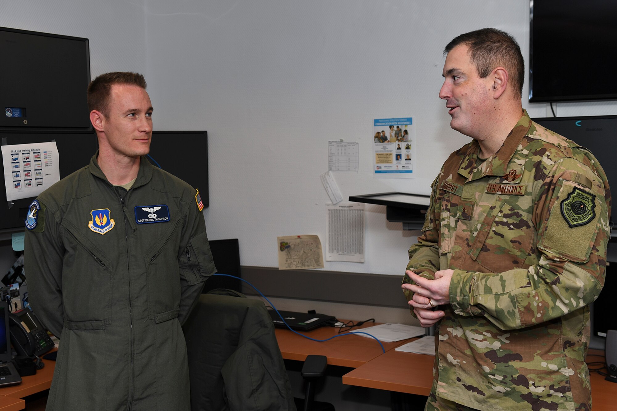 U.S. Air Force Staff Sgt. Daniel Thompson, 76th Airlift Squadron C-37A executive flight attendant, receives recognition from U.S. Air Force Brig. Gen. Mark R. August, 86th Airlift Wing commander, at the 76th AS on Ramstein Air Base, Germany, Jan. 3, 2019. Thompson was recognized for his excellence in executing the Air Force's mission across the European theater of operation. (U.S. Air Force photo by Staff Sgt. Devin Boyer)