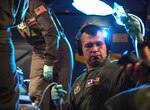 Tech. Sgt. Edgar Ramirez, 433rd Aeromedical Evacuation Squadron medical technician from Joint Base San Antonio-Lackland, participates in a training scenario during a C-5M Super Galaxy AE proof of concept flight from Scott Air Force Base, Illinois, Dec. 6, 2018. Active duty, Reserve and Delaware Air National Guard Airmen worked together during the PoC flight to test the cargo compartment of the C-5M with the goal of establishing the aircraft as part of the universal qualification training program for all AE crews. If approved and certified, the C-5M will have the capability to move three times the current capacity in one mission compared to other AE platforms.