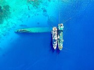 The U.S. Army, in partnership with the U.S. Navy and the Republic of the Marshall Islands, are safely recovering oil from the capsized World War II German heavy cruiser Prinz Eugen in the Kwajalein Atoll. These recovery efforts will ensure mission capability of the U.S. Army Space and Missile Defense Command/Army Forces Strategic Command’s Ronald Reagan Ballistic Missile Defense Test Site on Kwajalein while protecting the sensitive ecosystem within the atoll. The Prinz Eugen was transferred to the U. S. Navy as a war prize from the British Royal Navy after the war, and in 1946, it was loaded with oil and cargo and used to test survivability of warships during the Operation Crossroads atomic bomb tests at Bikini Atoll. The operation is being performed by Naval Sea Systems Command, Office of the Supervisor of Salvage engineers and is expected to last until the end of October. (U.S. Navy photo by LeighAhn Ferrari, chief mate, U.S. Naval Ship Salvor)