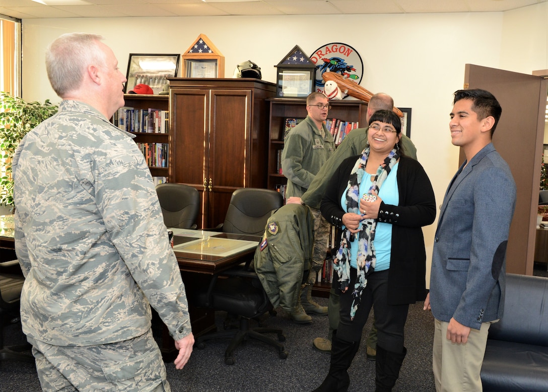 Lancaster High School student Enrique Arjona (right) and his mother, Monica Mancera, talks with Col. Kirk Reagan, 412th Test Wing vice commander, at 412th TW Headquarters Jan. 2. Arjona was congratulated on his acceptance to the U.S. Air Force Academy. (U.S. Air Force photo by Kenji Thuloweit)