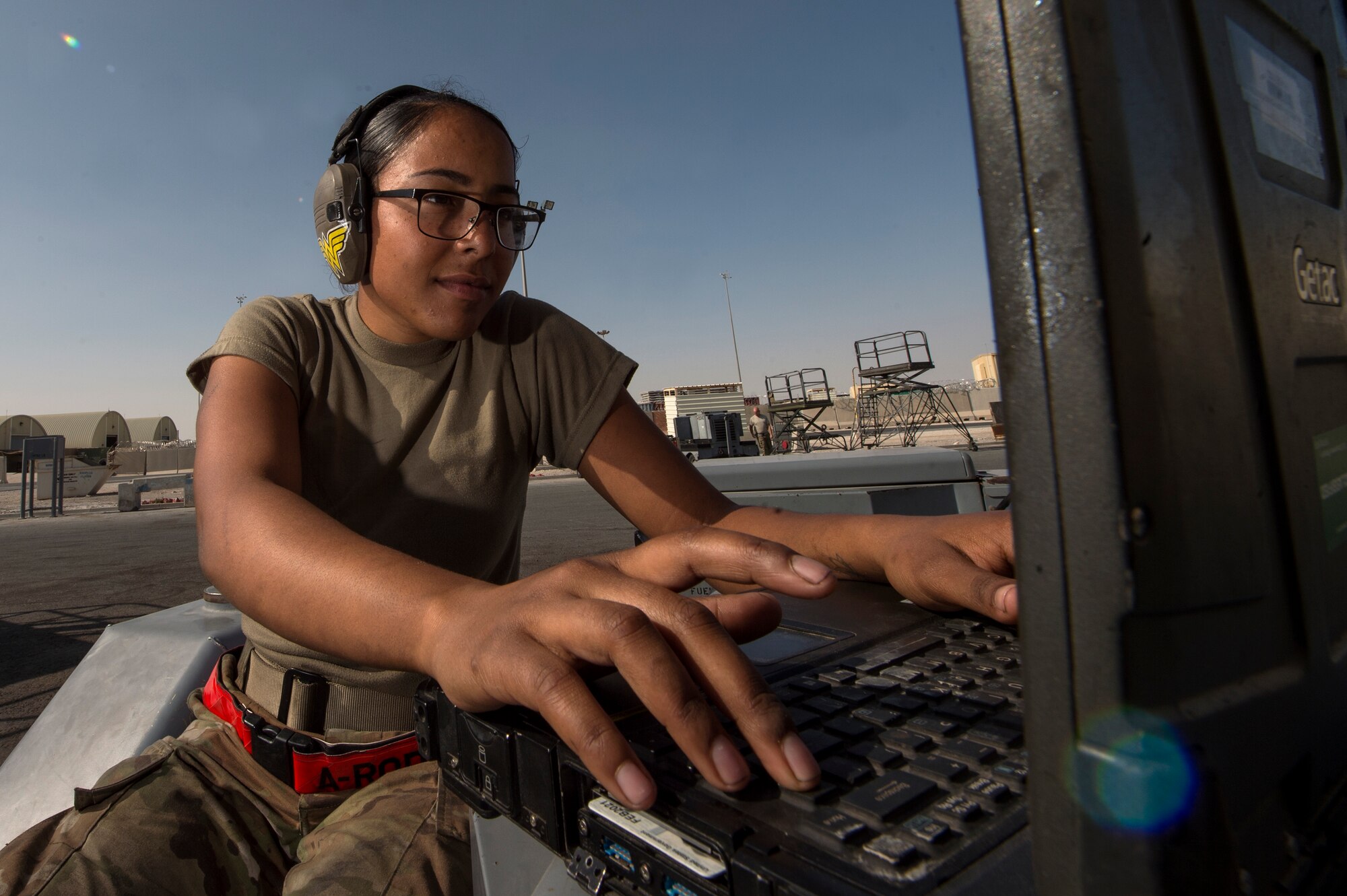 Airman 1st Class Annaliz Rodriguez, 379th Expeditionary Maintenance Squadron aerospace ground equipment (AGE) journeyman, reviews technical orders for clarification on performing maintenance for a bomb lift Jan. 4, 2018, at Al Udeid Air Base, Qatar. AGE Airmen here perform maintenance on a variety of aircraft equipment including bomb lifts, hydraulic test stands, air conditioners, heaters and power carts. (U.S. Air Force photo by Tech. Sgt. Christopher Hubenthal)