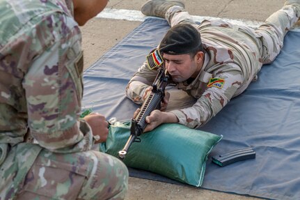An Iraqi soldier conducts a dime/washer drill as part of a primary marksmanship instruction course at Camp Taji, Iraq, Dec.19, 2018. The course is taught by Task Force India Bravo, a unit comprised of Soldiers from 1st Squadron, 98th Cavalry Regiment, 106th Support Battalion and 2nd Battalion, 114th Field Artillery Regiment, 155th Armored Brigade Combat Team, Mississippi Army National Guard, and is deployed in support of Combined Joint Task Force – Operation Inherent Resolve, working with the Iraqi Security Forces to develop a sustainable and inclusive force that can secure its sovereign borders, protect the population, and ensure the lasting defeat of ISIS.
