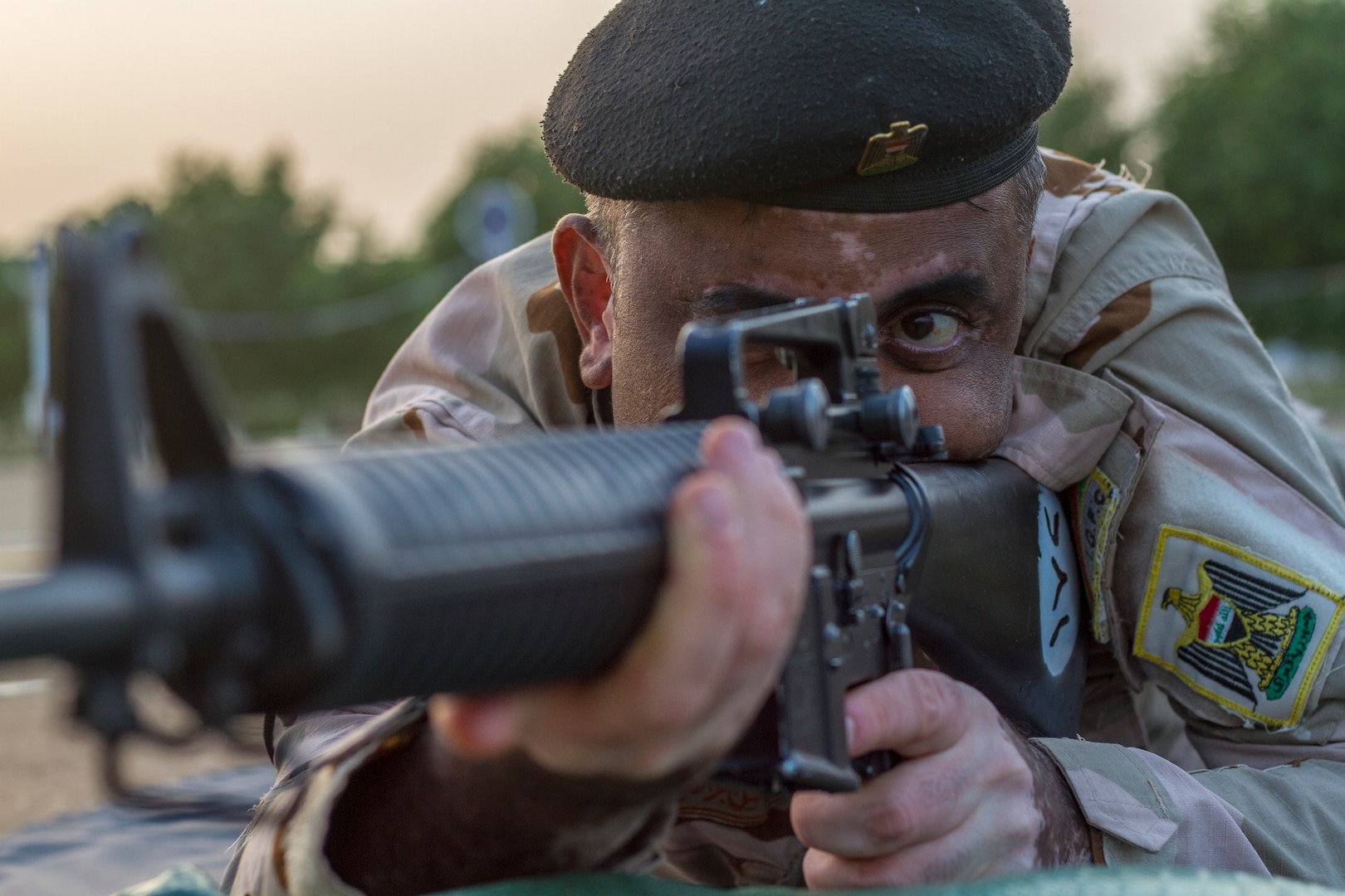 An Iraqi soldier conducts a dime/washer drill as part of a primary marksmanship instruction course held at Camp Taji, Iraq, Dec.19, 2018. The course is taught by Task Force India Bravo, a unit comprised of Soldiers from 1st Squadron, 98th Cavalry Regiment, 106th Support Battalion and 2nd Battalion, 114th Field Artillery Regiment, 155th Armored Brigade Combat Team, Mississippi Army National Guard, and is tasked with training the Iraqi 9th Armor Division. This Task Force is deployed in support of Combined Joint Task Force – Operation Inherent Resolve, working with the Iraqi Security Forces to develop a sustainable and inclusive force that can secure its sovereign borders, protect the population, and ensure the lasting defeat of ISIS.