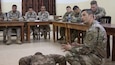 U.S. Army Sgt. 1st Class Mauricio Vasquez, the noncommissioned officer in charge of the intelligence section of the 300th Sustainment Brigade, demonstrates U.S. Army standards on Physical Readiness Training to Jordan Armed Forces soldiers using skills learned from the Foundation Instructor Facilitator Course, Dec. 17, 2018, at the Jordanian noncommissioned officer academy near the Joint Training Center, Jordan. Soldiers from both armies are instructors with decades of shared experience as teachers within their forces.