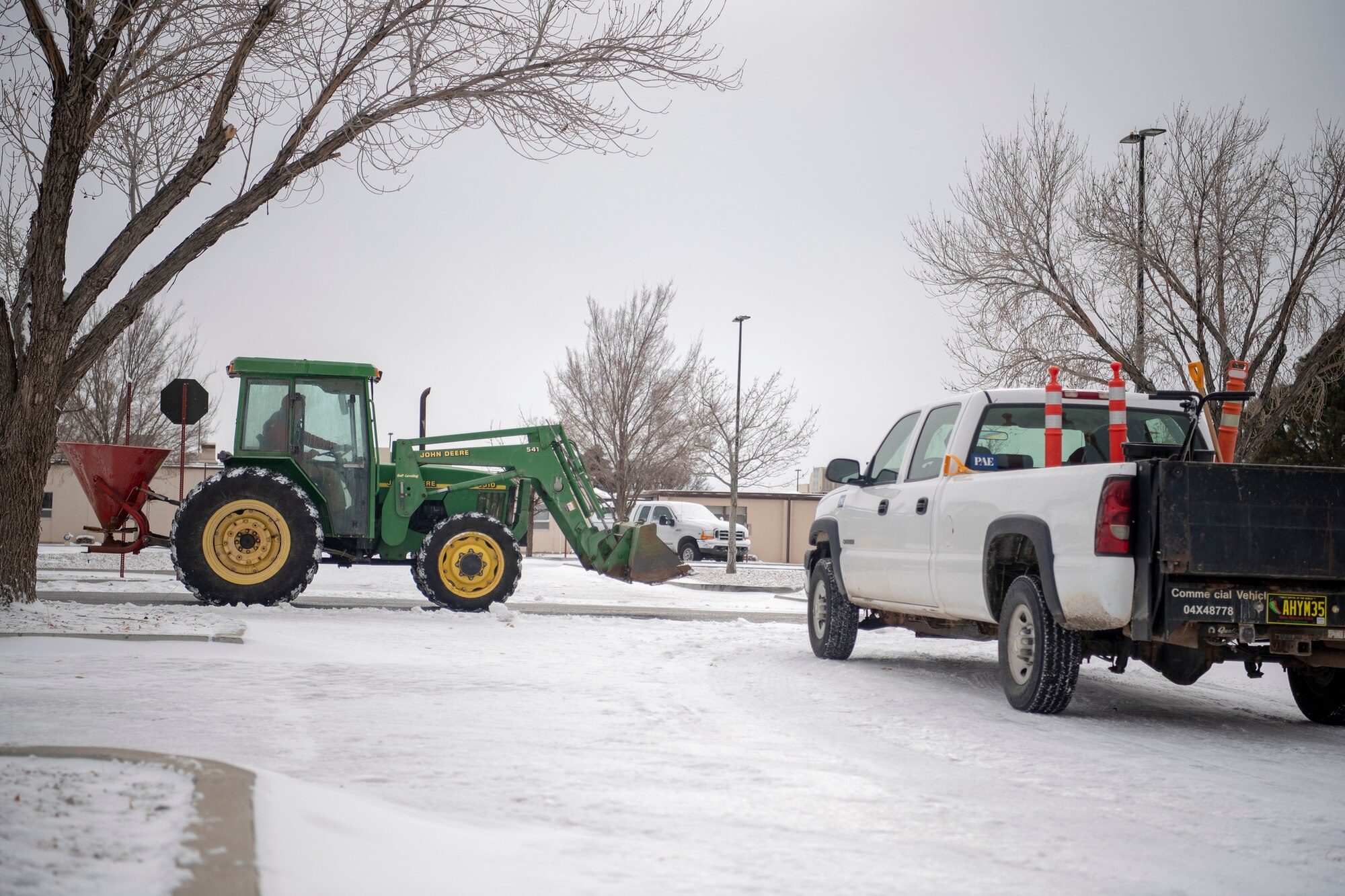 Kirtland personnel clear roads on Dec. 27, 2018. A blizzard blanketed the Albuquerque area and prompted closure of Kirtland Air Force Base to non-mission essential personnel on Dec. 27, and 28, 2018.
