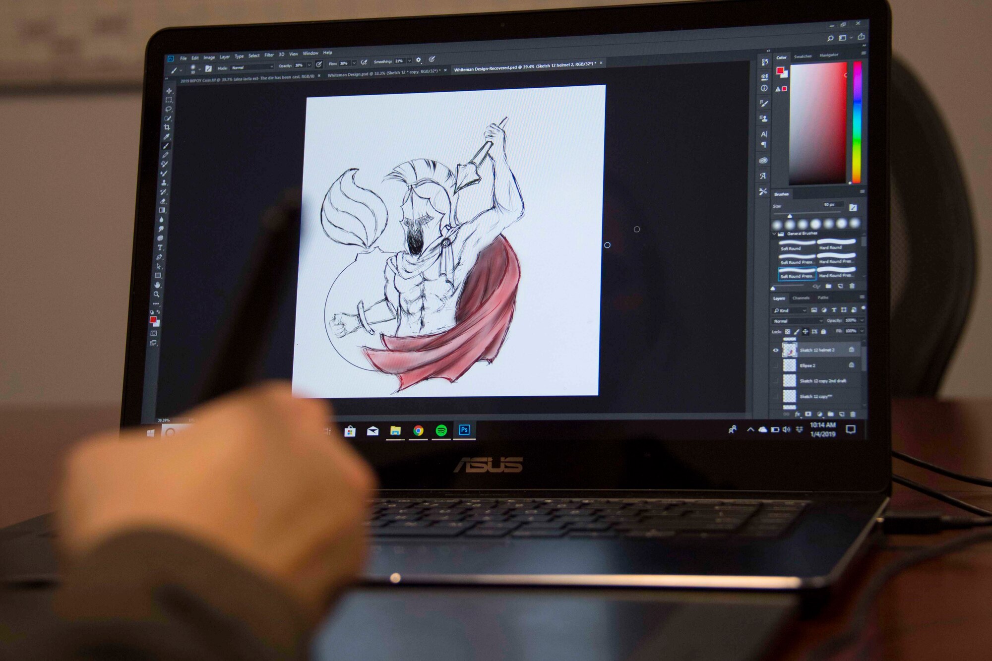 U.S. Air Force Sgt. Ashley Johnson, 707th Maintenance Squadron munitions technician, works on a mascot design at Barksdale Air Force Base, La., Dec. 4, 2019.   A trained artist, Johnson has created mascot designs for many Air Force units, including this one for a group at Whitman AFB. (U.S. Air Force  photo by Master Sgt. Ted Daigle)
