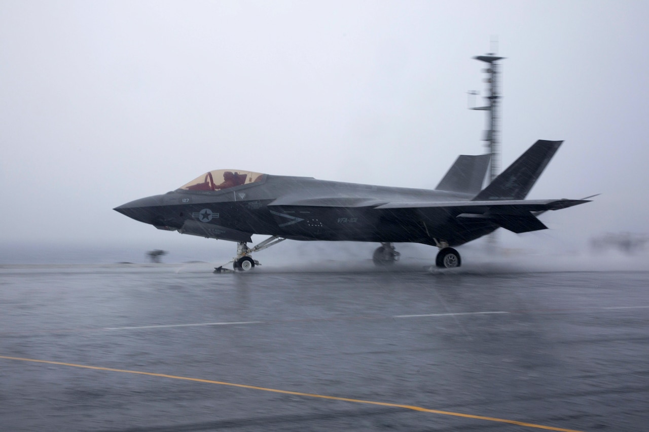 An F-35C takes off from an aircraft carrier.