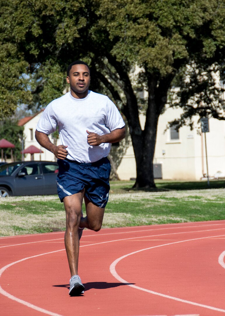 Tech. Sgt. Maurice Monroe, Air Force Manpower Analysis Agency Training Management Branch manager, runs laps during his lunch at the Rambler Fitness Center track, Joint Base San Antonio-Randolph, Texas, Jan. 3, 2018. Monroe uses exercise as a stress reliever and to improve his overall fitness.
