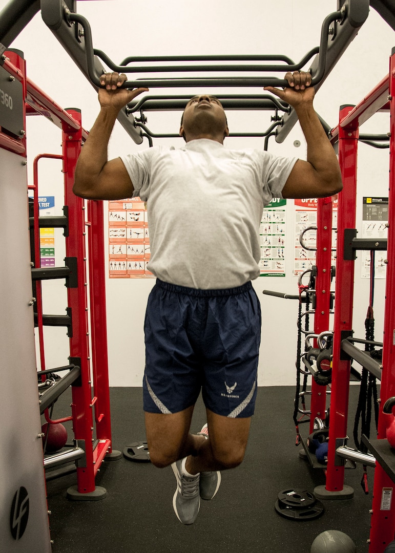 Tech. Sgt. Maurice Monroe, Air Force Manpower Analysis Agency Training Management Branch manager, does pullups at the Rambler Fitness Center during his lunch at Joint Base San Antonio-Randolph, Texas, Jan. 3, 2018. Monroe uses exercise as an outlet.