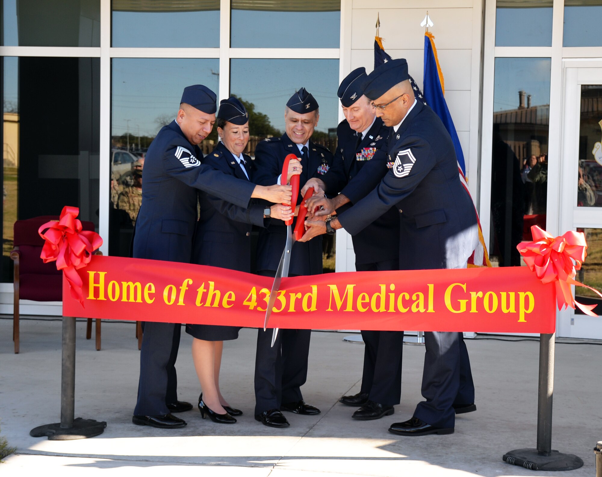 The 433rd Airlift Wing and 433rd Medical Group leaders cut a ribbon to signify opening the medical group’s new building Jan. 4, 2018 at Joint Base San Antonio-Lackland, Texas.