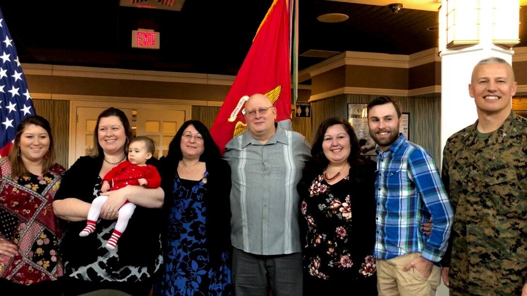 Col. William Bentley, the commanding officer of Marine Corps Base Quantico, Elaine Marsh, and her family pose for a photo during Elaine’s retirement at Lejeune Hall aboard MCB Quantico, Virginia, January 3, 2019. Elaine served as a federal employee for 31 years and 11 months.