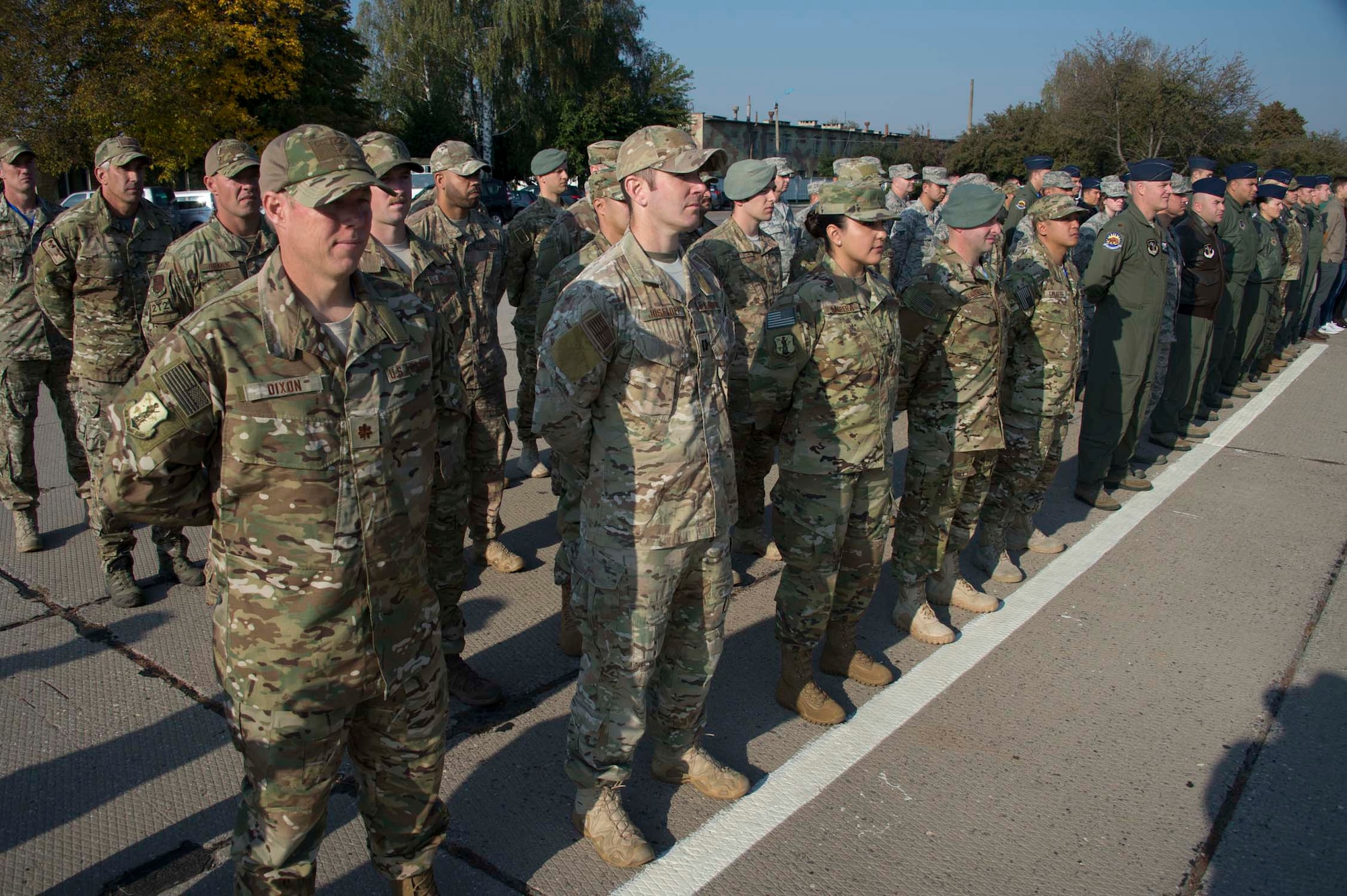 A formation of Americans, Estonians, Swiss, and Ukrainian military stand at the opening ceremony of exercise Clear Sky 2018 Oct. 8, 2018 at Vinnytisa Air Base, Ukraine. Clear Sky was a multi-national exercise aimed to promote peace, security and interoperability between regional allies as well as NATO partners. The two-week exercise brought together nearly 1,000 military personnel from nine countries. (U.S. Air National Guard photo by Master Sgt. Joseph Prouse)