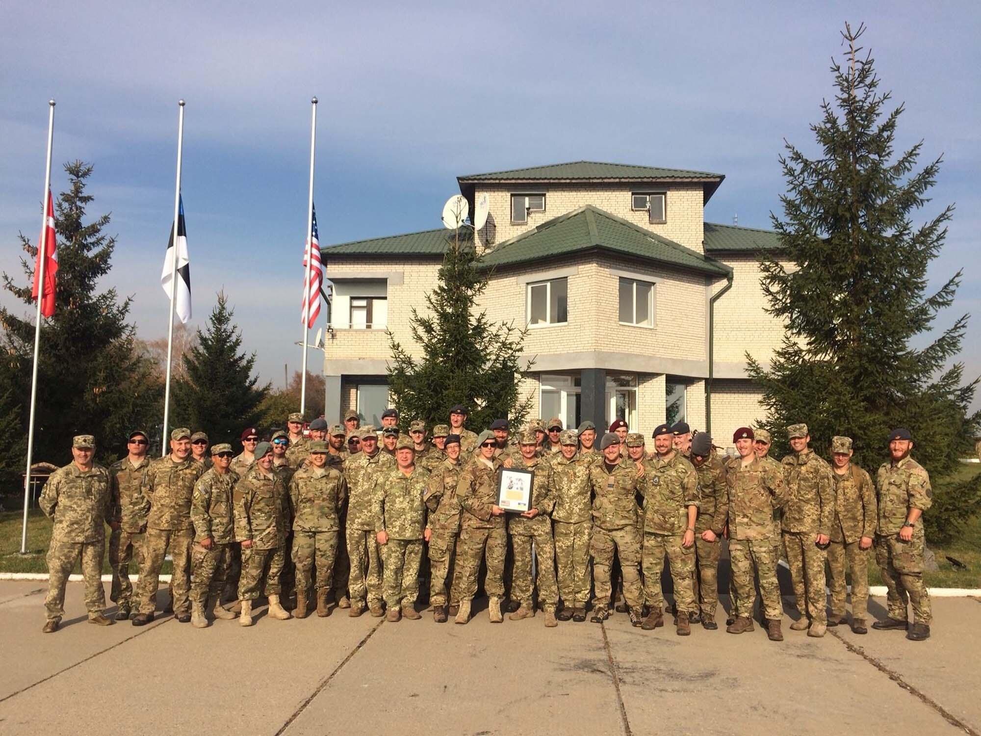 Airmen from 129th Rescue Wing and the 141st Air Refueling Wing pose alongside service members from the Ukrainian air forces Oct. 19, 2018 at Vinnytsia Air Base, Ukraine. Clear Sky was a multi-national exercise aimed to promote peace, security and interoperability between regional allies as well as NATO partners, the two-week exercise brought together nearly 1,000 military personnel from nine countries. (U.S. Air National Guard photo by Staff Sgt. Brian Jarvis