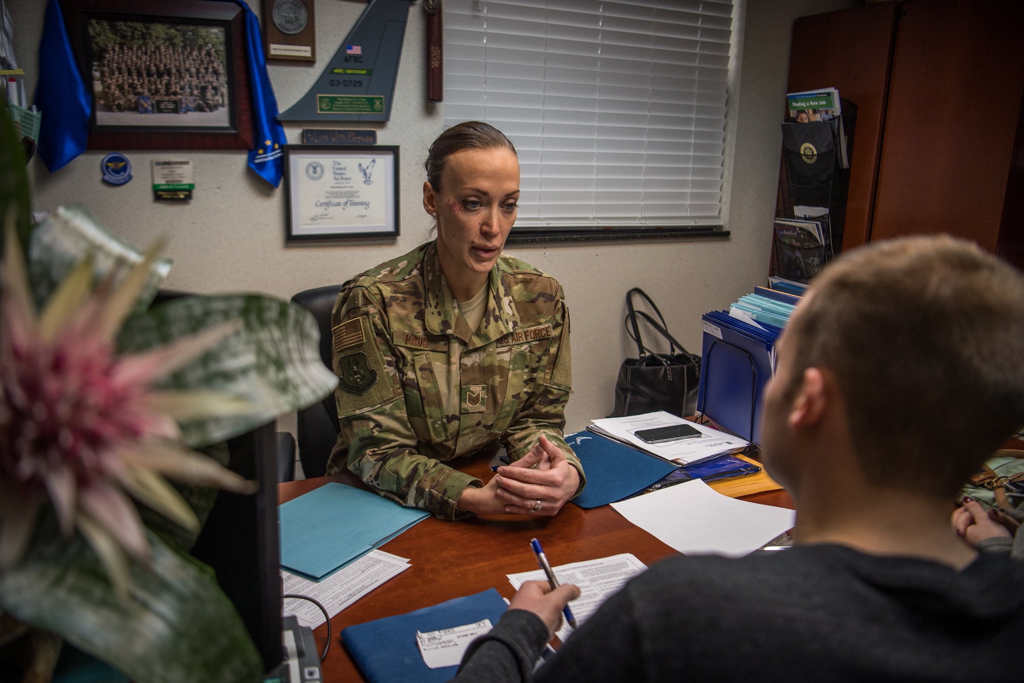 Air Force Reserve recruiter helps with last enlistment in 2018 for the  932nd Airlift Wing.