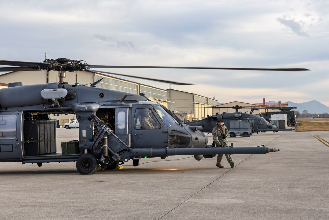 Airmen with the 56th Rescue Squadron prepare HH-60G Pave Hawk helicopters fore takeoff at Aviano Air Base, Italy, Dec. 17, 2018. The 56th Rescue Squadron provides a rapidly-deployable, worldwide combat rescue and reaction force response utilizing HH-60G Pave Hawk helicopters.