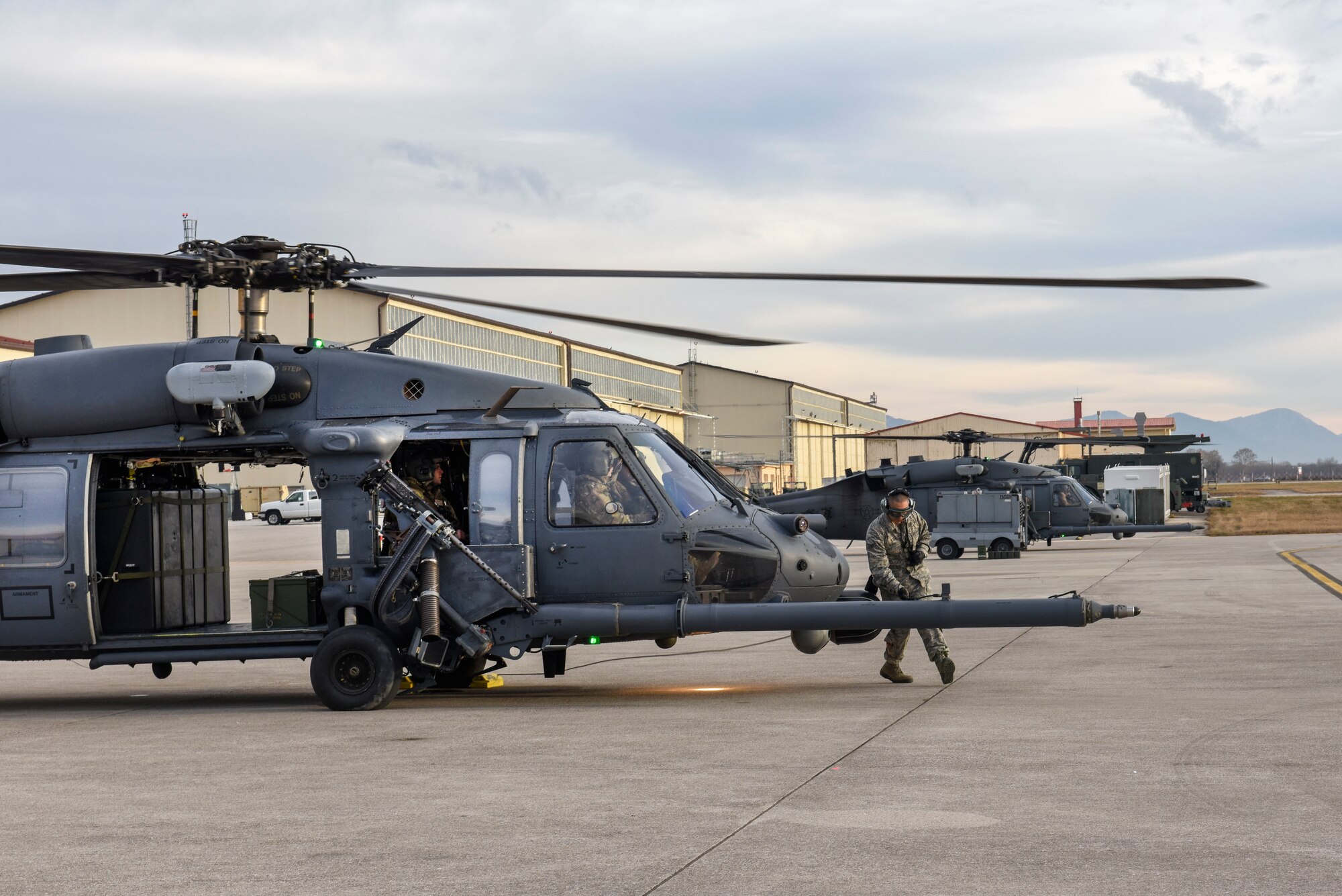 Airmen with the 56th Rescue Squadron prepare HH-60G Pave Hawk helicopters fore takeoff at Aviano Air Base, Italy, Dec. 17, 2018. The 56th Rescue Squadron provides a rapidly-deployable, worldwide combat rescue and reaction force response utilizing HH-60G Pave Hawk helicopters.
