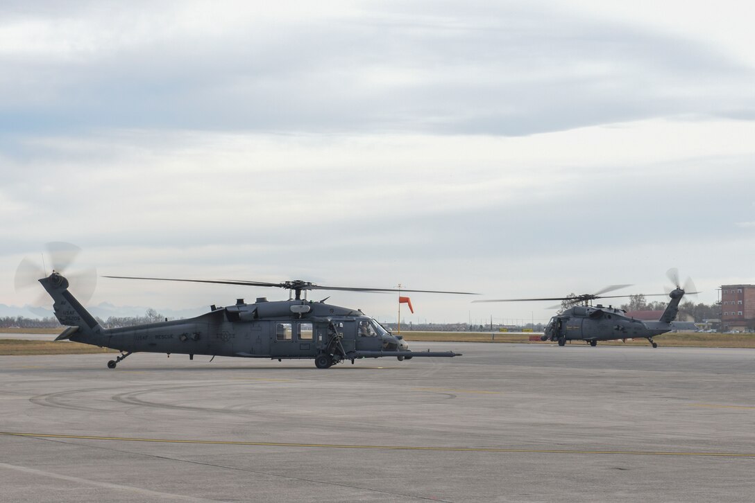 Two HH-60G Pave Hawk helicopters assigned to the 56th Rescue Squadron prepare to takeoff at Aviano Air Base, Italy, Dec. 17, 2018. The 56th Rescue Squadron provides a rapidly-deployable, worldwide combat rescue and reaction force response utilizing HH-60G Pave Hawk helicopters.