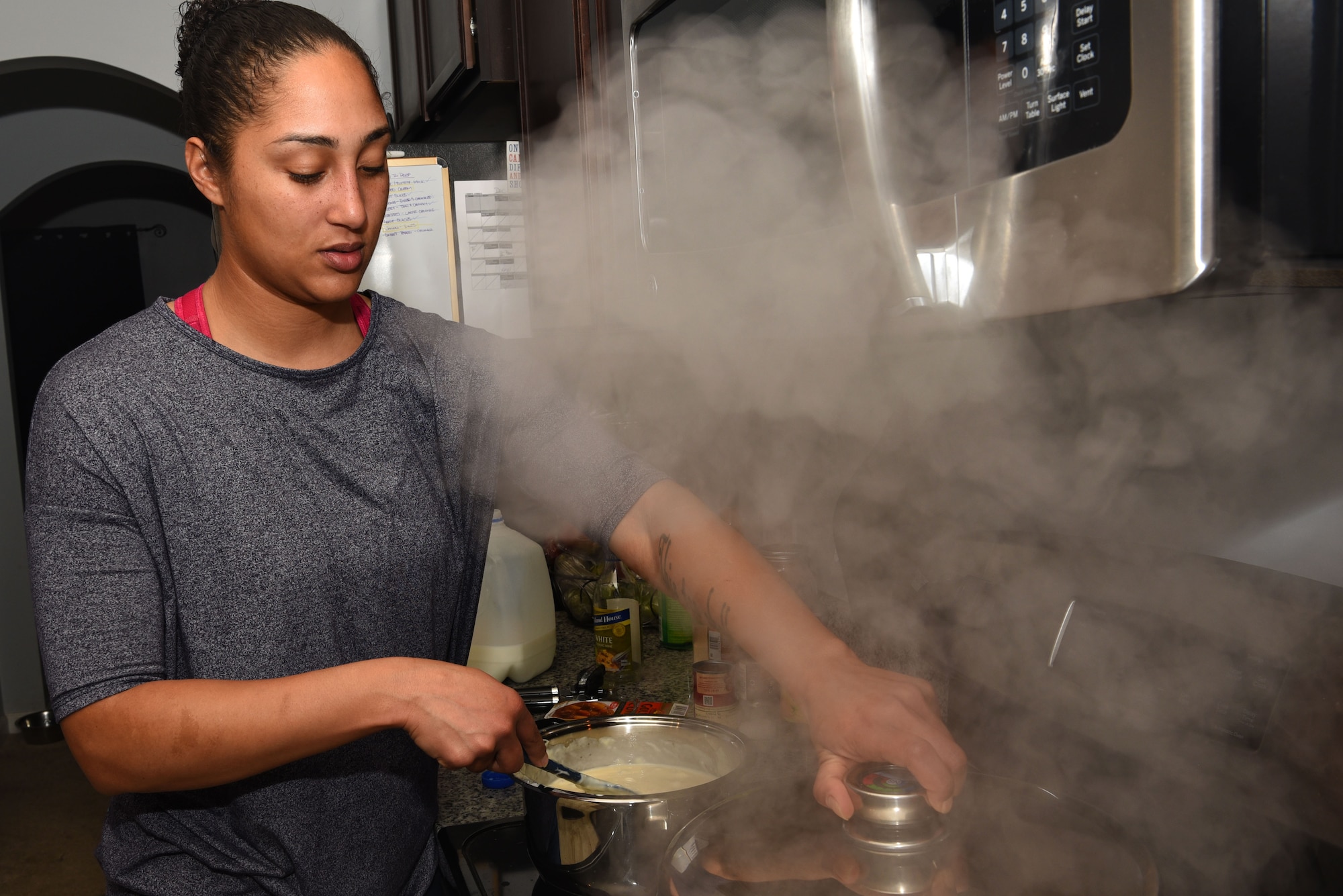 U.S. Air Force Tech. Sgt. Ashley Grugin, 20th Aircraft Maintenance Squadron unit fitness program manager, prepares a meal at her residence in Sumter, S.C., Dec. 16, 2018.